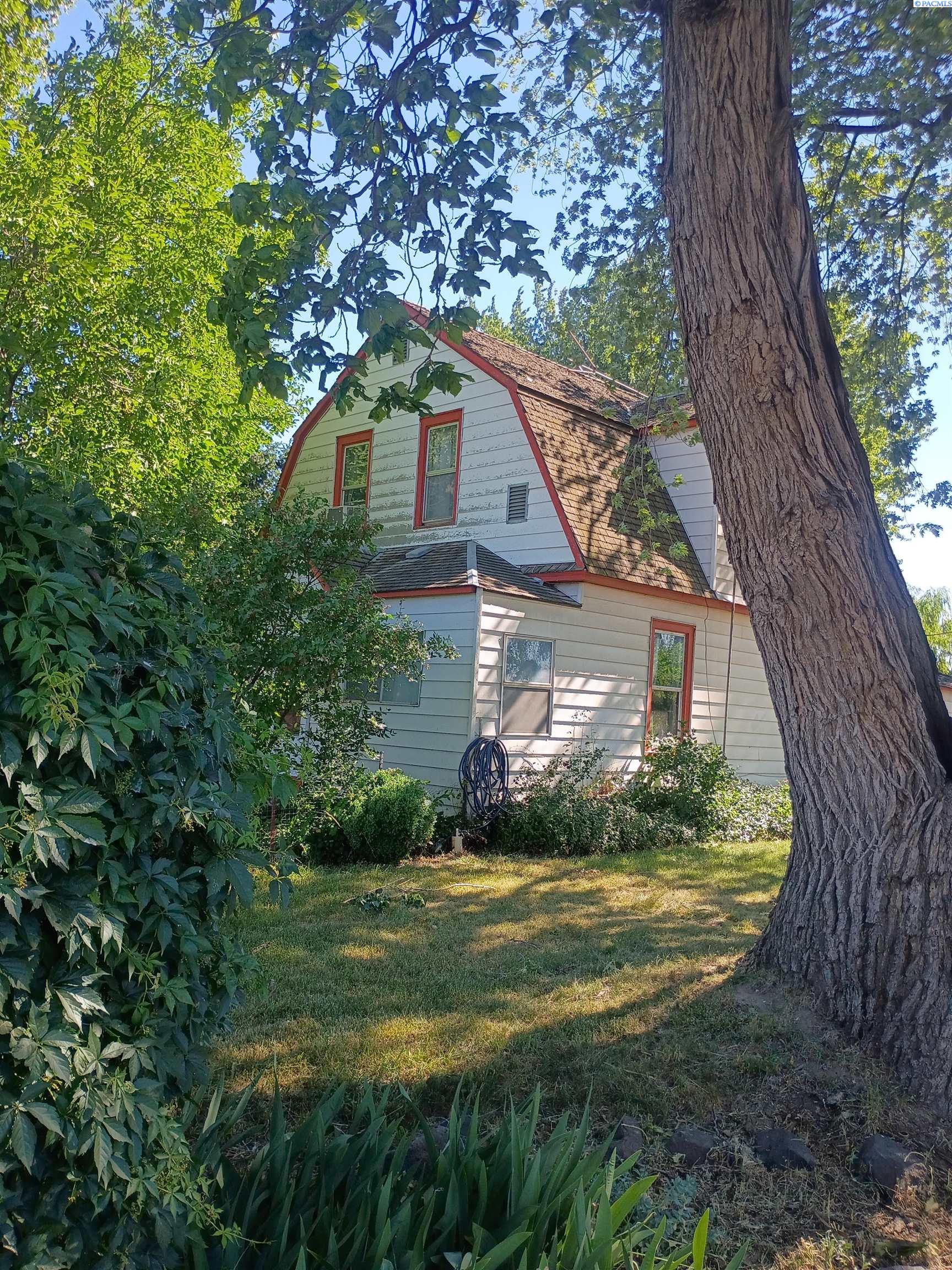 MLS# 293940 Unique opportunity to own a versatile property combining residential living with small farming potential. This 3 bedroom, 1 bath home offers approximately 1429 sq ft of living space and sits on a generous 1.76-acre parcel. There are 3 outbuildings providing ample room for equipment, vehicles, or future expansion.  The three out buildings add value functionality and versatility to the site. Contact your real estate professional today to schedule a showing.