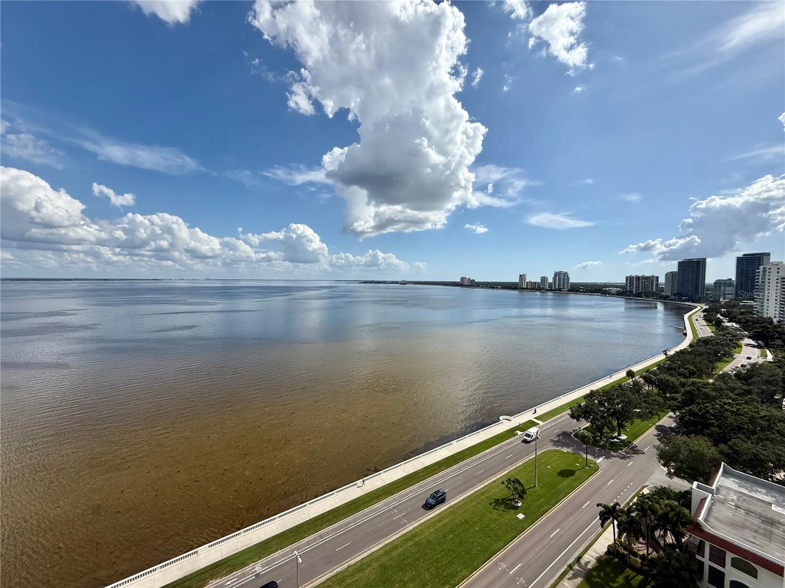 One or more photo(s) has been virtually staged. This RARE IS OPPORTUNITY TO OWN A WATERFRONT CORNER in the Atrium is among the most coveted in the building, offering spectacular, UNOBSTRUCTED VIEWS of Tampa Bay from the 18th floor. Enjoy front-row views of Bayshore Boulevard and the Gasparilla Parade from the expansive wraparound terrace—approximately 6 feet wide and 54 feet long—perfect for entertaining or relaxing in style.
ROUGHLY $100,000 UPDATED. This 2-bedroom, 2-bathroom, 1,504 sq ft unit has been thoughtfully updated with new stylsh bathrooms, flooring, refrigerator, washer, and dryer. Included are two dedicated parking spaces (#12 and #174) for added convenience. NOTE - Parking #174 is currently rented on a month-to-month basis.

Step into a stunning waterfront residence where sophistication meets serenity. The master suite is a private retreat, featuring floor-to-ceiling glass doors that showcase breathtaking water views, a spacious walk-in closet, and a beautifully renovated en-suite bathroom with mirrored vanities.
Located just minutes from Hyde Park Village, Downtown Tampa, Tampa International Airport, and Tampa General Hospital, this condo offers both convenience and luxury.

The Milestone Study is complete, and the Special Assessment has been paid. The Atrium offers a well-equipped fitness center, a club room with a full kitchen for entertaining, 24-hour on site security, Waterfront heated pool & spa, club room & library, Pet-friendly community. 
Flood and building insurance are included in the HOA, making this high-rise condo a truly exceptional living experience.
