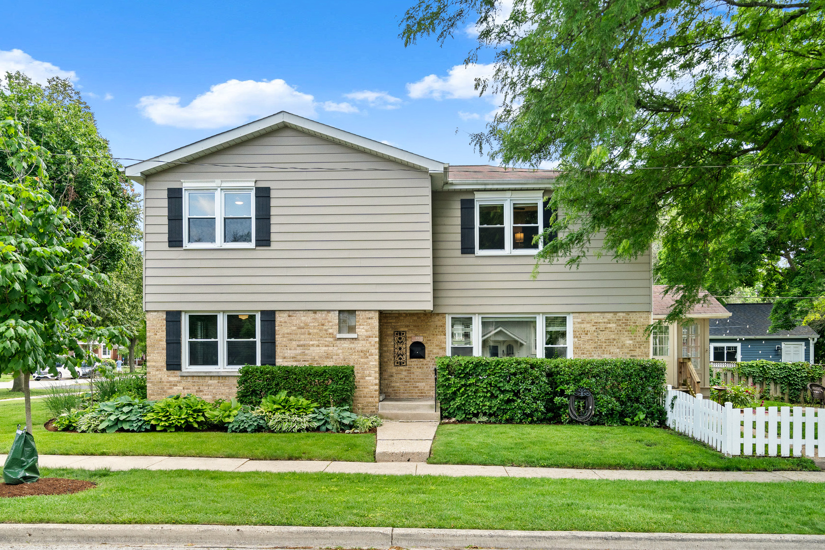 Thoughtfully updated and filled with charm, this spacious 4-bedroom, 3-bathroom home in a desirable Arlington Heights location offers an incredibly flexible layout across all levels.        The main floor features a rare combination of a bedroom and dedicated office-ideal for guests, multigenerational living, or remote work. You'll also find a full bathroom, a spacious living room, formal dining area, and a beautifully renovated kitchen with island seating, ample counter and cabinet space, and room for a breakfast table. A bright sunroom adds additional living space with views and access to the backyard.        Upstairs, the private primary suite includes a walk-in closet and full bathroom. Two additional bedrooms share a third full bath, while a loft with built-in desks creates a perfect spot for studying, reading, or creative projects.        The finished basement adds even more versatility with a cozy family room, a large flex room (ideal as a gym/studio) currently used as an additional office, plus a laundry and generous storage room.        Outside, enjoy a fenced backyard with a patio and grill area, and a large detached garage with extra storage.        Recent improvements include: renovated kitchen and bathrooms, newer windows and flooring (within the past 6-7 years), full basement renovation (within 2 years), and a new sewer system connection (a $13K investment) for added peace of mind.        Located near downtown Arlington Heights, Metra, restaurants, parks, and schools-this move-in-ready home combines comfort, character, and everyday functionality.
