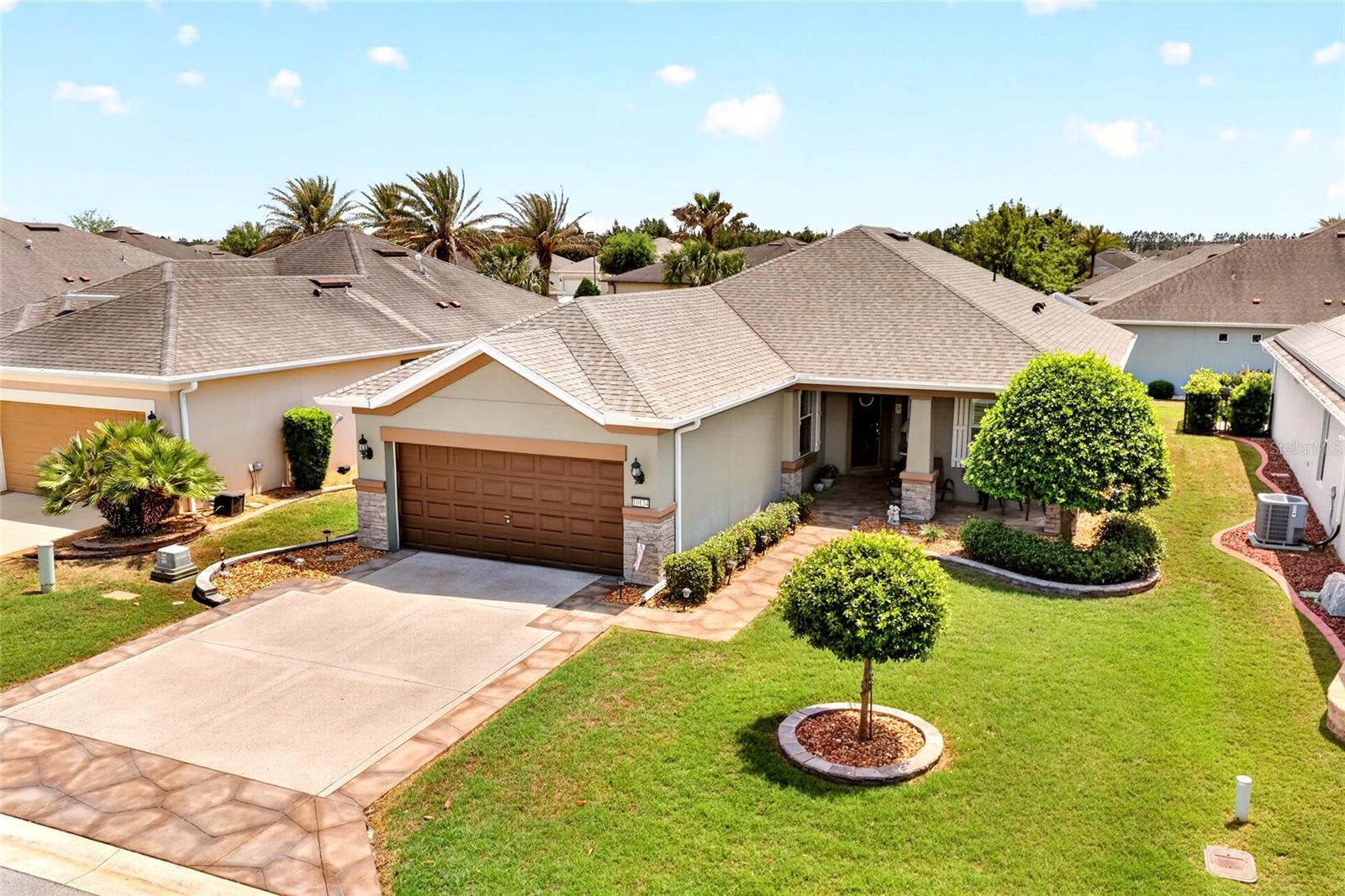 Beautifully updated Surrey Crest model located in the desirable Stone Creek of On Top of The World is now available! As soon as you arrive at this residence there is a statement from the outside curb appeal offering a custom driveway, and mature landscaping on the front exterior. Upon walking up to the entry, you will be pleasantly greeted by a large covered porch, perfect for mornings with coffee. When you enter the residence you will find an abundance of natural light flowing from corner to corner, and new luxury vinyl plank throughout the entire home. At the heart of the home, the kitchen offers newer stainless steel appliances with granite countertops and an island for dicing along with 42' inch cabinets with crown molding. An eat in area is shared with the kitchen that allows for a dining room table fitting 6. The large living room provides ample entertaining space for guests to join in as well. The master suite can seamlessly fit a king sized bed set and has an updated ensuite master bathroom. A large, brand new tiled stand up shower in the ensuite compliments the dual sinks and private water closet. Bring all your clothes for the walk-in closet as well! This model offers a spare bedroom at the font of the home along with a den area perfect for an office space or DYI room. One of the greatest compliments to this home is there are custom plantation shutters throughout for keeping the Florida sunlight to your liking. Off of the living room is the Florida room with an oversized 3 door sliding glass entry. Easily made under air or opening up with windows to let the fresh Florida air inside. Back porch features a paver patio with a remote controlled sun setter shade, and gorgeous sun set views in the evenings. Newer big ticket components include 2023 architectural roof, and 2017 newer HVAC. NO CDD HERE! You also own the land. Home comes with irrigation system already in place. With a LOW HOA of $265.44 you enjoy access to multiple pools, tennis courts, pickleball, miles of walking trails, sidewalks, golf course (additional playing fee), clubhouse, and many more activities! Florida lifestyle living at its finest, come and see it today!