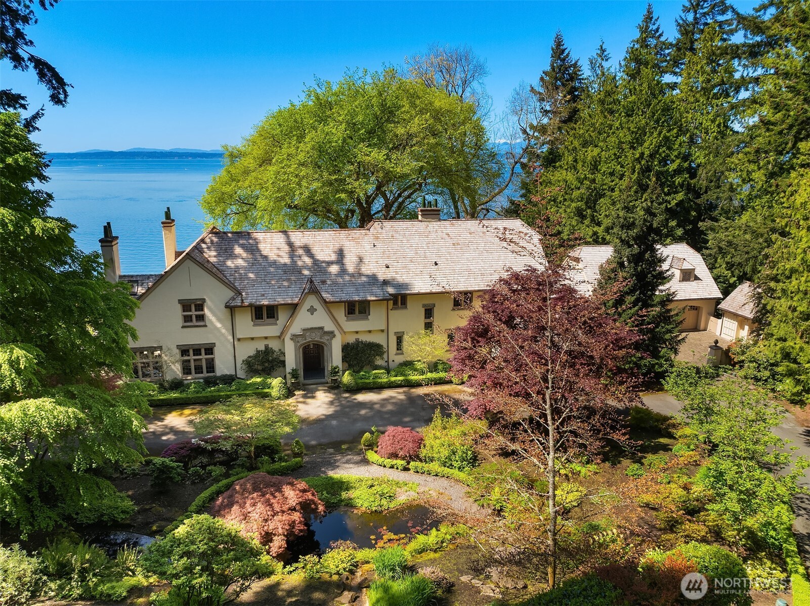 One of Edwin Ivey’s finest estates, located in The Highlands with 3.31 acres and over 250 feet of Southwest-facing frontage above Puget Sound. Enjoy Sound & Olympic views and sunsets paired with timeless European Tudor Revival design. The original 1921 grandeur is intact, but with the benefits of a 2005 complete refit by Schultz Miller. This is luxury living defined. Greet your guests in the formal entry and concert hall, or from the circular driveway with formal gardens, fountains, & auto-court. Explore all 11,000+ square feet of interior or lose yourself in the views from the South lawn and West Terrace. An estate worthy of hosting unforgettable events, yet equally enjoyed sharing with a few friends and a special bottle from the cellar.