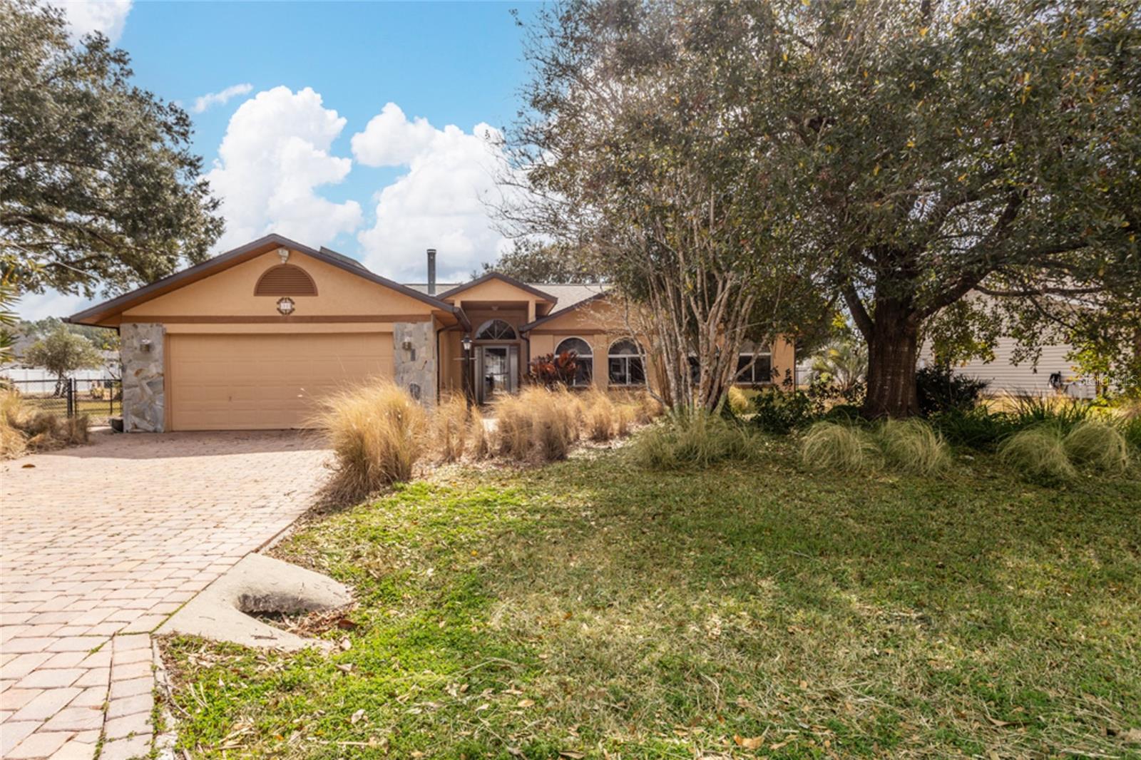 Make this spacious pool home yours! This 4-bedroom, 2.5-bath residence is designed for comfortable living and entertaining. The inviting living room features a cozy wood-burning fireplace and sliding glass doors that open directly to the pool area, creating seamless indoor-outdoor flow.  The generously sized primary suite also offers private access to the pool, providing a relaxing retreat at the end of the day. Secondary bedrooms are well-proportioned, including one with its own attached half bath—ideal for guests. A versatile flex room off the breakfast area includes a closet and can easily serve as a fourth bedroom, home office, or hobby space.  Recent updates add peace of mind and value, including a new roof (2023), owned solar system (2023), HVAC system (2021) with air scrubber, and a solar water heater. Some upgrades have been done to the kitchen and bathrooms.Enjoy the best of Florida living with your private pool and a location convenient to shopping and dining throughout Palm Coast, as well as the beautiful Flagler Beaches.