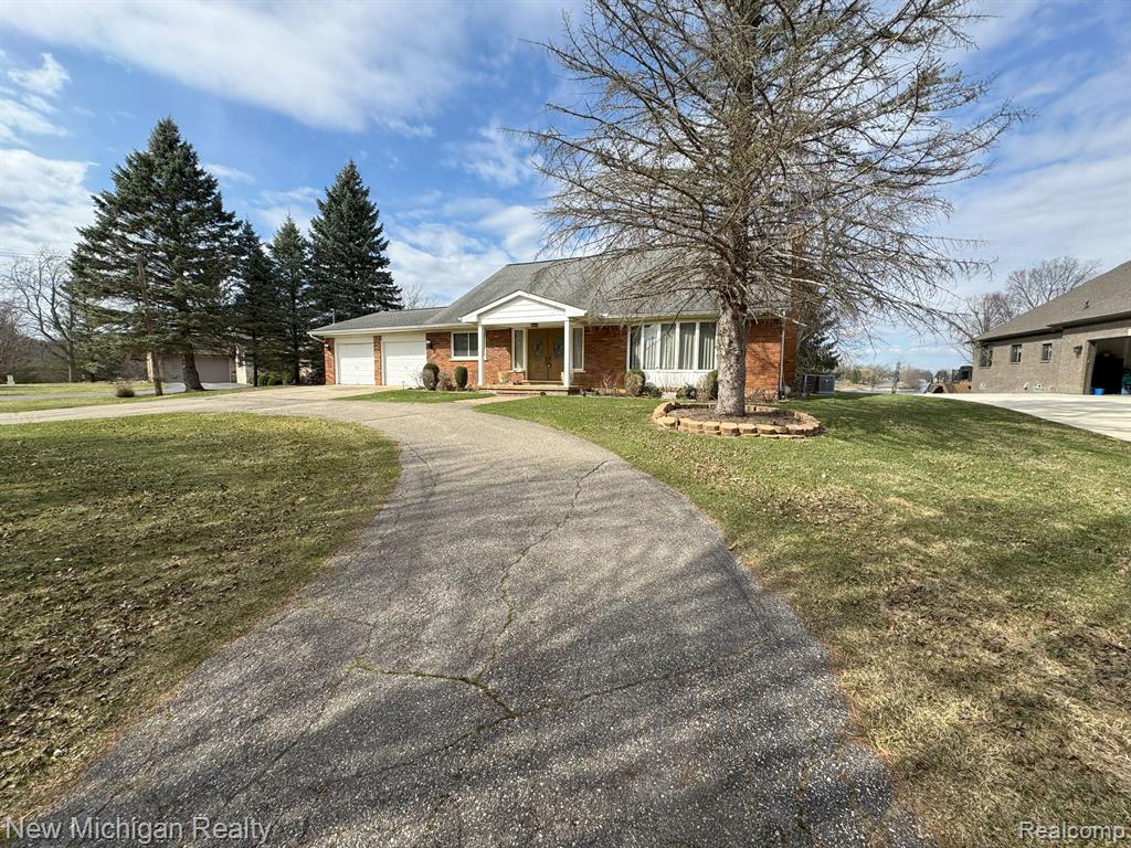 Original owner 2000+ sq ft home on beautiful Lake Lapeer. This spacious brick home has 4 bedrooms, 70 feet of frontage, attached 2 car garage garage and a walkout basement just waiting to be finished! .42 acre lot  (tax id 010-450-097-00) directly across the street included in sale for an additional $60,000.