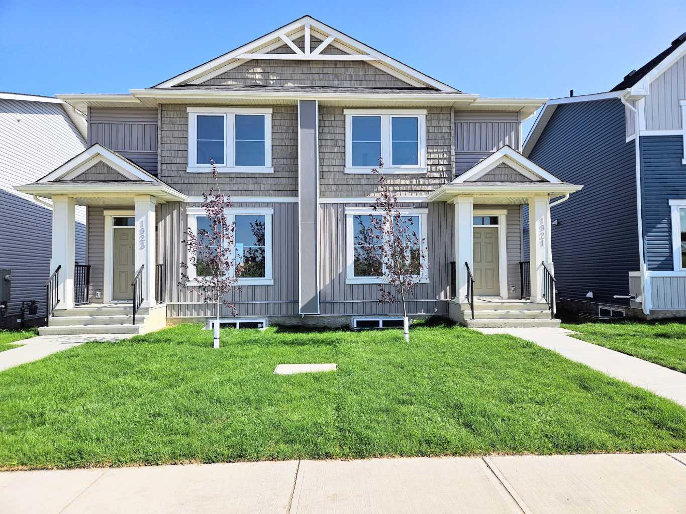**WELCOME TO IRON LANDING IN CROSSFIELD!** Discover the perfect blend of comfort, space, and community living in this beautifully maintained **2-storey half duplex**, ideally situated in a family-friendly neighbourhood.Offering **3 bedrooms upstairs**, this home provides plenty of room for growing families. The **unfinished basement features a separate side entrance**, offering an excellent opportunity to create additional living space, including a potential bedroom and bathroom, subject to the necessary permits and approvals.Step outside and enjoy the spacious **13' x 7' deck**, perfect for morning coffee, summer BBQs, entertaining friends, or relaxing with the family. The **double detached garage** provides ample parking and storage, adding to the convenience of this well-designed property.The location is ideal, with walking paths and **Veterans Park just steps away**, along with schools, baseball diamonds, soccer fields, playgrounds, the recreation centre, and splash park all close by.Enjoy the convenience of **restaurants, a bakery, and other local amenities nearby**, making everyday living easy and enjoyable. Plus, Airdrie amenities, including Superstore, are just approximately **10 minutes away**.Whether you're looking for your first home, a place to raise your family, or a property with room to grow, this home offers **space, convenience, outdoor enjoyment, and a welcoming community lifestyle.****Come see everything this home and Iron Landing have to offer—book your private showing today!**