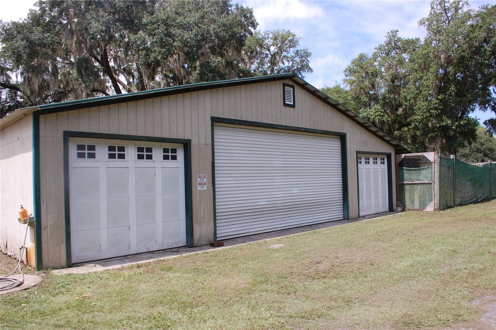 CERTIFIED ORGANIC BLUEBERRY FARM - Welcome to the farm life. This amazing property, located in Lochloosa Farms, is a five-acre parcel, (10 acres with 5 acres to be split by survey) is an active Blueberry Farm with over eight varieties of berries. Beautiful three-bedroom, two-bath home with approximately 2,268 sq. ft., including an in-ground pool. From the patio area, you can drink your morning coffee and watch the sunrises, with views of the blueberry field. This property is beautifully landscaped and has wood fencing. Property includes a Packing house - 4,988 sq. ft., two dock heights with receiving doors, w/dock plates, sealer pad, and light. Back dock is 424 sq. ft. open with one dock plate; the back of the enclosed area has one garage door. Inside is equipped with an icyene installation, two air conditioners, in the packing area, and two refrigerated units in the cooler room. There is a small office, storage, and two bathrooms, all on a deep well and septic. Including a 4,800 sq. ft. storage barn/office with a metal roof with kitchen, sink, and bathroom area. For more storage, there is an older barn with a shop area with cement slab floors, closed in w/garage door (4) and one main door which is 36" for a total of 2,264 sq. ft. Gas storage area with a 250-gallon tank with a 9 x 7 tin roof over next to a 16 x 16 closed in barn. This barn has concrete floors and a water softener. One of the areas has been converted into a one-bedroom, one-bath apartment. The organic certificate is transferable. The equipment list is available. An additional 34 +/- acres available. Call for a showing of this piece of heaven in the Country.