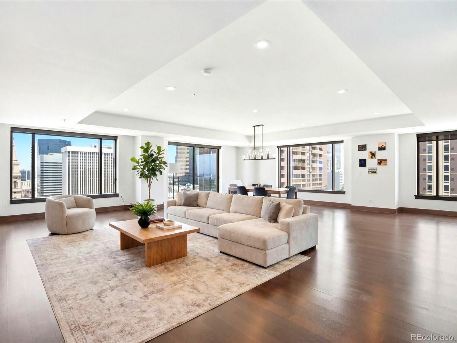 Priced at $677 per square foot — the lowest entry point at the Four Seasons Residences since 2019 — this is a rare chance to acquire a legendary address at a compelling discount. With recent comparable sales closing well above $1,000 per square foot, the equity upside here is as compelling as the lifestyle. The open floor plan frames sweeping city and mountain views, with the iconic 16th Street Mall clocktower as a centerpiece. Hardwood floors, soaring ceilings, and a gas fireplace anchor the living and dining spaces, while the chef's kitchen delivers a waterfall island, designer backsplash, under-cabinet lighting, and a full suite of Sub-Zero and Miele appliances including a gas range and hood. The primary suite is equipped with a five-piece spa bathroom with soaking tub, dual vanities, and a generous walk-in closet, and finishes that showcase a hotel-level polish. The second bedroom captures sweeping southwestern views of the Rocky Mountains. Two parking spaces are also included. Ownership here is about more than a beautiful home, it’s about the Four Seasons lifestyle: 24 HR concierge, valet, security and engineering, plus access to signature amenities including two fitness centers, outdoor pool, spa facilities, and a residents-only house car, with a la carte services like housekeeping and in-home dining. Iconic and priced to move, this is a private, designer residence wrapped in the service and discretion that only Four Seasons can deliver — available today at a price the market hasn't seen in years.