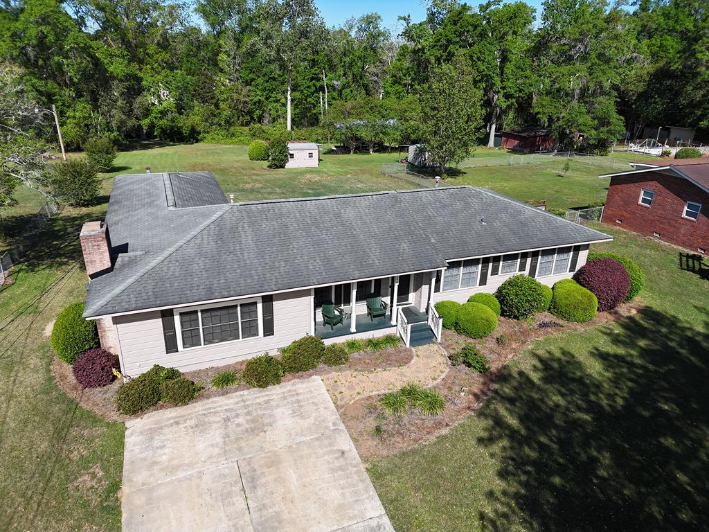 Make yourself at HOME in this adorable 4BR/3Bath house on Skyline Dr. in Thomasville, GA! The layout in this 2008 sq.ft. home is incredible! The front door leads into a formal living room, nice kitchen, dining room, and three great bedrooms on one end of the house. At the other end you will find a HUGE fireside den, connected to a wonderful in-laws suite, complete with bedroom, bathroom and kitchen! This great home sits on 1.6 acre property, with nicely landscaped front lawn and shrubbery, and a sprawling backyard that ends at a creek. Call your favorite agent TODAY for a closer look! Click here for virtual tour: https://my.matterport.com/show/?m=Phr6B4E2Z7b&mls=1