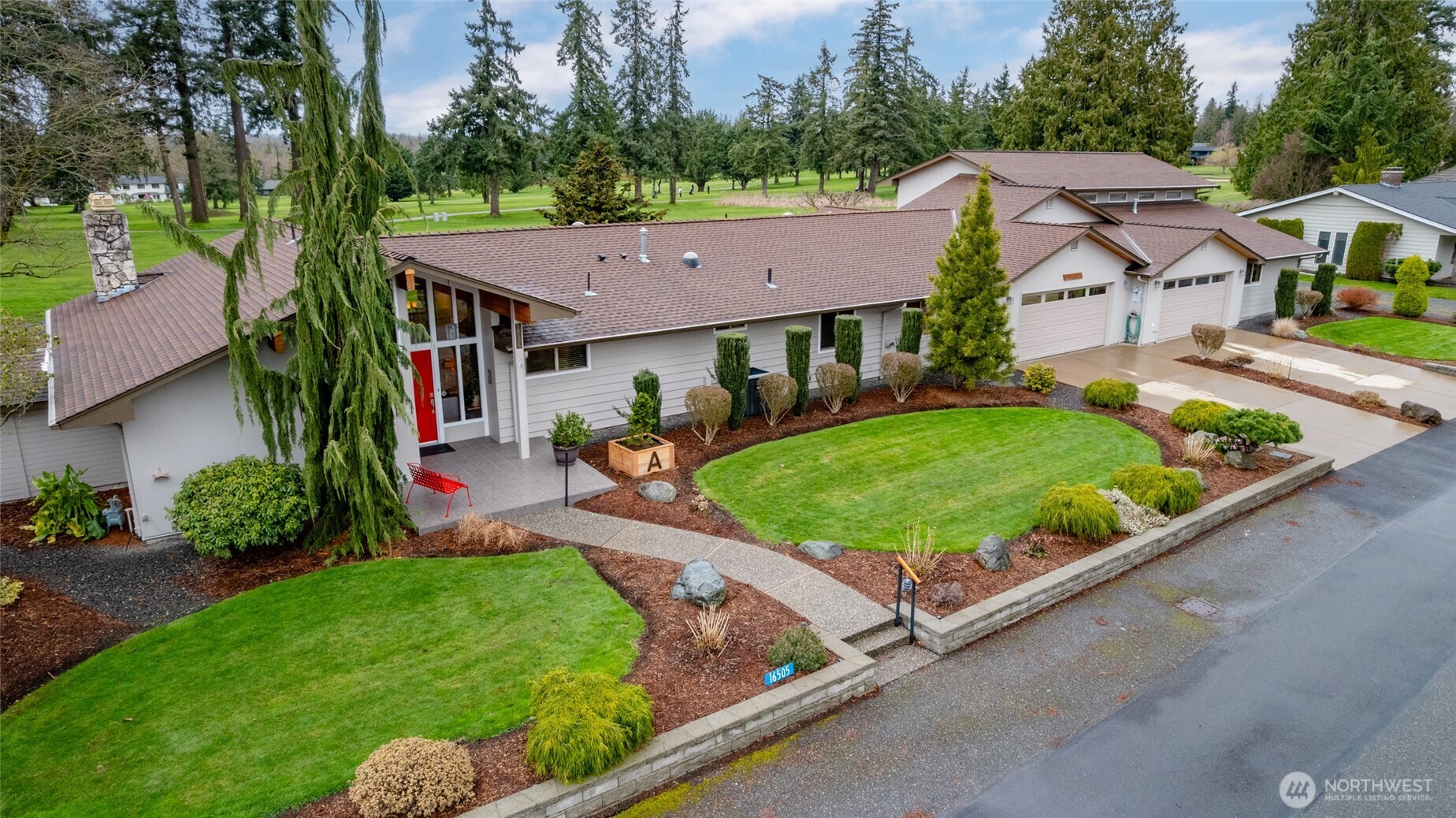 It’s rare to find a double lot w/a home & shop in the desirable Skagit Golf & Country Club—here’s your opportunity to make it yours. Thoughtfully updated, the home begins w/a beautifully remodeled kitchen featuring quartz countertops, cherry cabinetry w/soft-close, double ovens, wine fridge & bar seating area. The living room showcases expansive windows w/golf course views, a cozy gas fireplace & vaulted cedar ceilings. A charming family room/office offers the perfect retreat, complete w/a nearby half bath. The remodeled primary suite boasts an oversized walk-in shower, double vanity, spacious custom walk-in closet & a exercise room that opens to a private deck—ideal for a future hot tub. Two additional bedrooms also include closet organizers for added functionality. A generous utility room provides flexibility for laundry, hobbies, or crafts. Hobbyists will appreciate the exceptional garage & shop space, designed with three separate areas. One bay includes a dedicated garage door ideal for a golf cart or toys. The expansive heated main shop offers a 14-foot door w/room for an RV, plus additional workspace & storage to suit a variety of projects. Outdoor living shines w/a sprawling patio complete w/gazebo & firepit—perfect for entertaining year-round. The covered BBQ area is just steps away & a second patio along the side of the home adds more space. You'll also find a fenced garden, greenhouse, shed & abundant parking. Welcome to space, functionality & golf course living.