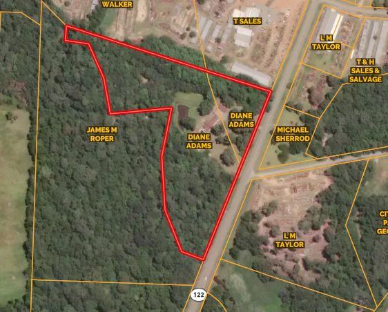 11 Acre parcel of land with towering pines, massive Swamp Chestnut Oaks, and a winding creek with well a defined, high creek bank.  There is a big old world of discovery on this 11 acres.  If you want a little time in the woods, a place to go hunting, or a homesite that will support a nice home and offer room to grow...this is your land.  There was once a home on the property.  There is a deep well and an outbuilding on the property.  There is a small pond on the property that backs up to Reedy Creek.  (As dry as it has been, the pond still has water and still has some fish in it.) The property has been vacant for some time.  Check it out.  Lay out where your home would go. Explore the woods!  Check out the creek.  l love these woods.  See if you find the deer rubs that are scattered over the property.  One acre of the property is inside the city limits of Pavo. With some TLC, the Barn/Shop Building on the property could be used as an apartment or workshop.(Pictures on the way.)    As we cruise into spring and summer...where the boots and don't forget bug spray.