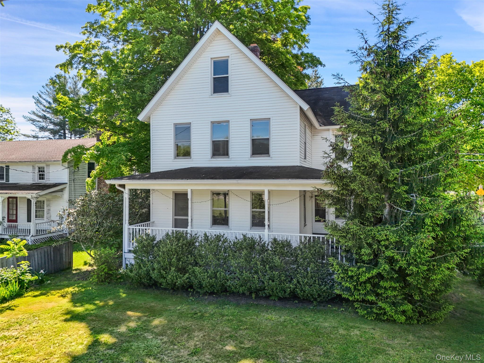 VINTAGE VILLAGE FARMHOUSE. Conveniently located in the heart of Bedford Village with easy access to shops, restaurants, the theater and library. Beautifully maintained Farmhouse dating to 1900. Nicely proportioned rooms with hardwood floors and period millwork. Charming rocking chair front porch. Bright and cheery Living Room with lots of windows to capture natural light. Formal Dining Room. Cozy Den with aged wood paneling. Country Kitchen with door to Sunroom. Three nicely sized Bedrooms. Level .28 acres with verdant lawns, mature shrubs and fine trees. Detached Garage with two garage bays, workshop and ample storage space. Wonderful and convenient in-town location just minutes to schools and commuting arteries. The village lifestyle!