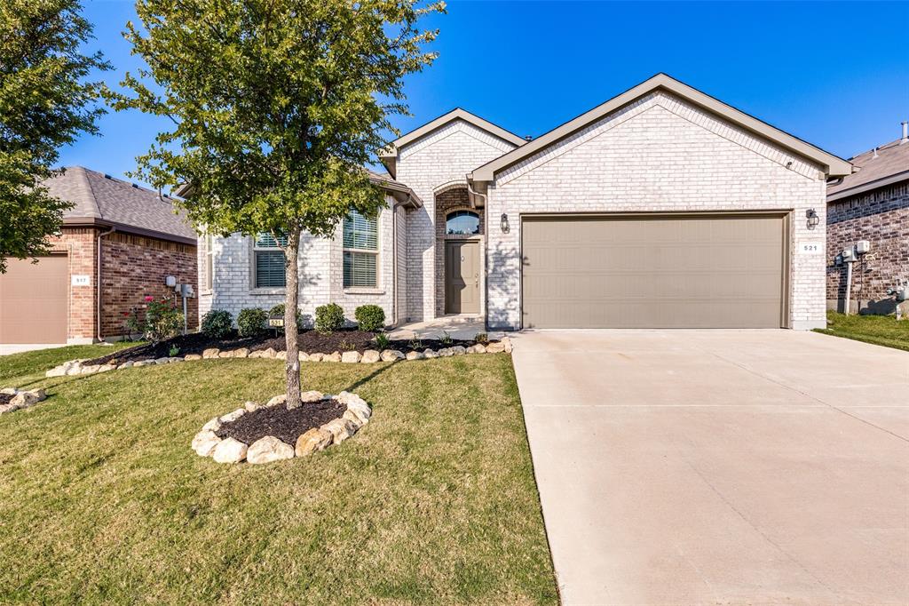 Welcome to this beautifully designed single-story home located in the highly sought-after Northwest ISD. MOVE IN READY! Featuring four spacious bedrooms and two full bathrooms, this residence blends modern comfort with timeless style.  An open-concept layout and wood-look tile flooring throughout create a seamless flow from room to room, offering both durability and sophistication. The gourmet kitchen boasts sleek cabinetry, ample counter space, refrigerator included, and overlooks the inviting living area — perfect for entertaining or relaxing with family. A tankless water heater ensures endless hot water and added energy efficiency. The primary suite provides a serene retreat with a private bath, while three additional bedrooms offer flexibility for guests, a home office, or hobbies. Outside, enjoy a covered patio and easy-care yard. CLASS 3 ROOF REPLACED IN MARCH 2025. Just steps away from the community pool. This prime location puts you close to popular shopping, dining, and entertainment options, combining convenience with a welcoming neighborhood atmosphere. Don’t miss the chance to make this modern Northwest ISD home yours — schedule your showing today! MUST SEE IN PERSON.