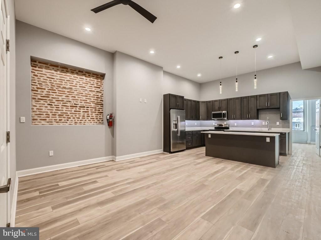 Newly renovated with gorgeous contemporary fixtures and finishes in handsome, secure historic Mt. Vernon rowhome featuring a carved rotunda skylight above an elegantly curving staircase.  Excellent Mid-Town location, just a few blocks from Penn Station, close to MICA, Peabody Conservatory, UB, Walters Art Gallery and the Washington Monument.  A multitude of dining, shopping and nightlife options in the immediate area.  Super high ceilings with recessed lighting add to the grand feel.  Individually controlled central heat and A/C. In-unit laundry. Parking available in lot directly across the street.