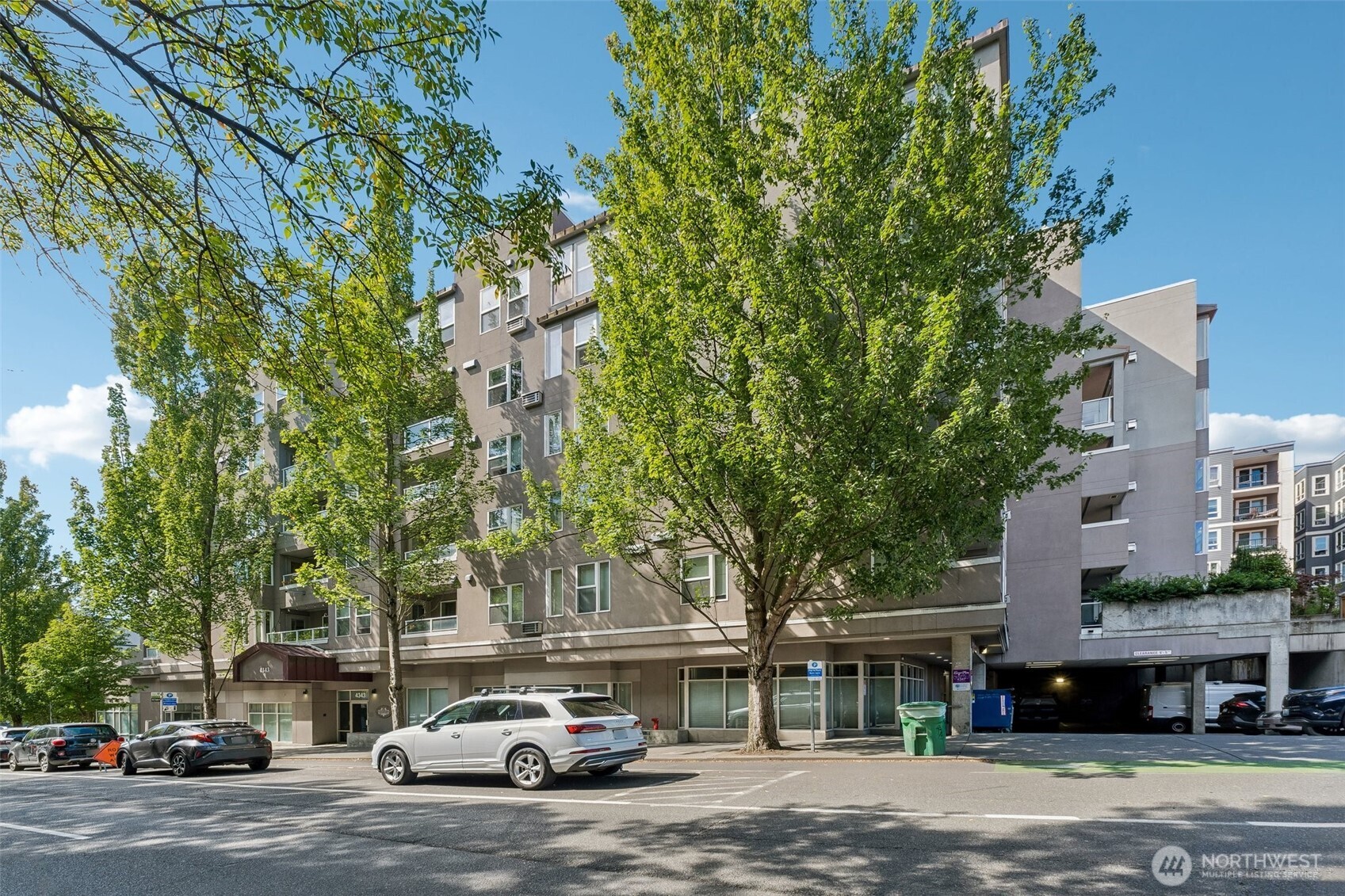 Welcome to this beautifully updated condo in the heart of Seattle's University District! Enjoy breathtaking city and mountain views from the rooftop patio - an ideal spot to relax or entertain. The unit features a cozy gas fireplace, A/C and a secure gated one-car assigned parking space. Brand-new over-the-range microwave, dishwasher and stove add convenience and peace of mind. Ideally located near the University of Washington, light rail, restaurants, shopping and everyday amenities. With no rental cap, this property offers excellent flexibility and a great investment opportunity. Strong rental demand from UW students makes this an especially attractive option for investors. Whether you're looking for a home, a convenient location near UW or a rental investment, tis is an opportunity you won't want to miss!