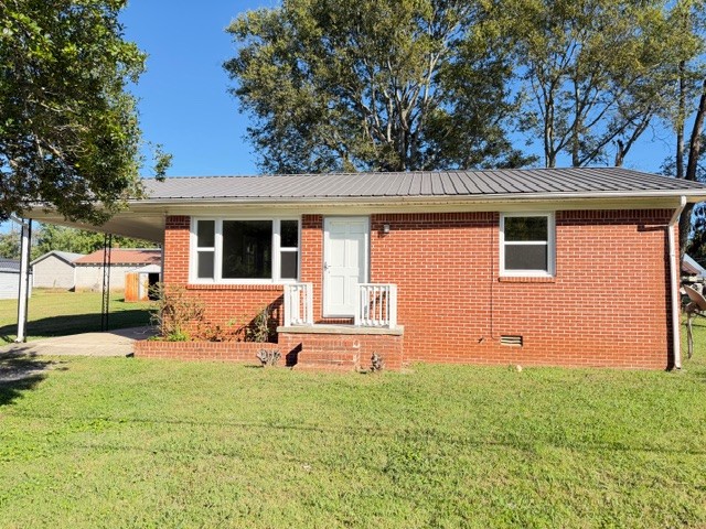 Charming 2-bedroom 1 bath brick cottage comes complete with new windows, new laminate flooring, light fixtures, cabinets, and fresh paint throughout.  Each of the 2 bedrooms is comfortably sized and filled with natural light. Move-in ready!!