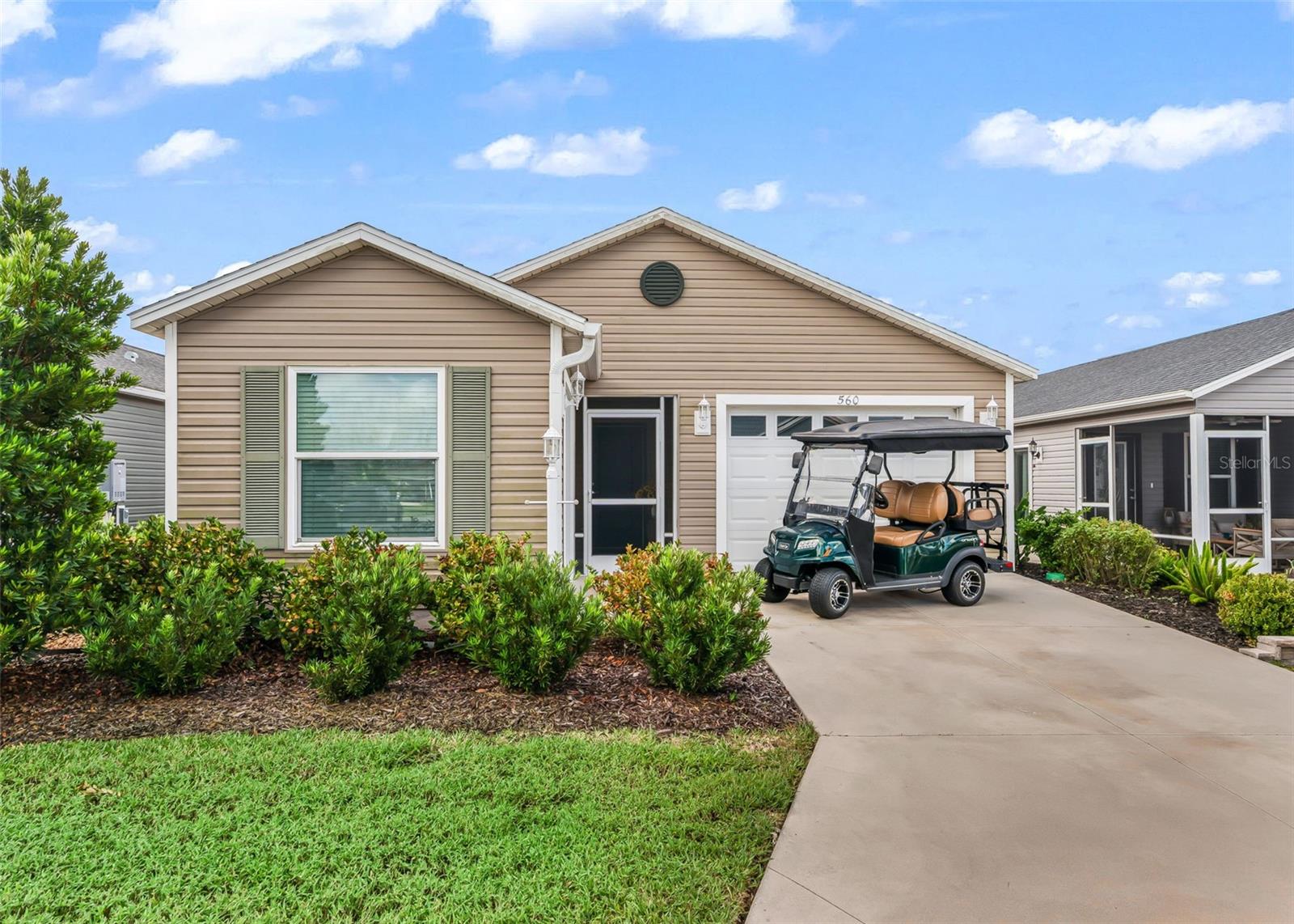 PACK YOUR BAGS — THIS ONE IS READY FOR YOU! Offered TURNKEY, this Patio Villa in the Village of St. Catherine comes complete with a 2023 Club Car GAS GOLF CART with ONLY 44 HOURS and the bonus everyone loves — a GOLF CART GARAGE! Inside, VAULTED CEILINGS give the home an open, airy feel, while the kitchen backsplash adds just the right finishing touch. You’ll also appreciate the convenience of INSIDE LAUNDRY. Relax in your SCREENED LANAI with a ceiling fan and enjoy Florida’s beautiful weather. The LOCATION is hard to beat — just a golf cart ride to Sawgrass Grove, Brownwood Paddock Square and Eastport for dining, shopping, entertainment and more. Whether you're looking for a full-time home or Florida getaway, this one is ready to enjoy from day one!