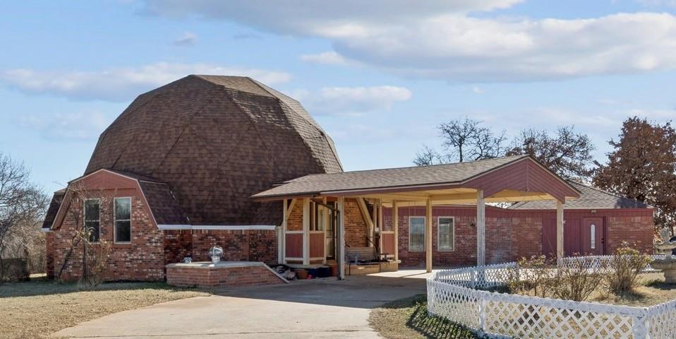 Looking for something a little more unique? Then you must see this geodesic home in Newcastle in person! The main home features 3 bedrooms, 2 baths, and 2 living areas. The primary bedroom & bath are downstairs. The 2 guest bedrooms and additional full bath are upstairs in the loft area. The kitchen provides ample granite countertops, gas range, dishwasher, trash compactor, and custom oak cabinetry with an abundance of cabinets and drawers. Previous owners converted the garage into a studio apartment with its own entry, kitchenette, laundry hook-ups, bathroom, and bedroom/living area - perfect for a guest suite, extra income, or home office/studio. Outside is the inground storm shelter, a fenced area for kids and pets, and a storage room attached to the back of the studio apartment. The Sellers said you will be able to enjoy the views of those incredible Oklahoma sunsets from your front porch! Improvements since ownership include - most of the windows in the main home replaced in 2021, roof replaced in 2021, & foundation work completed in 2026. Situated on a one acre corner lot in the quiet Quail Run community of Newcastle. Close to I-44 and Hwy 37 providing easy access to OKC and the surrounding areas.