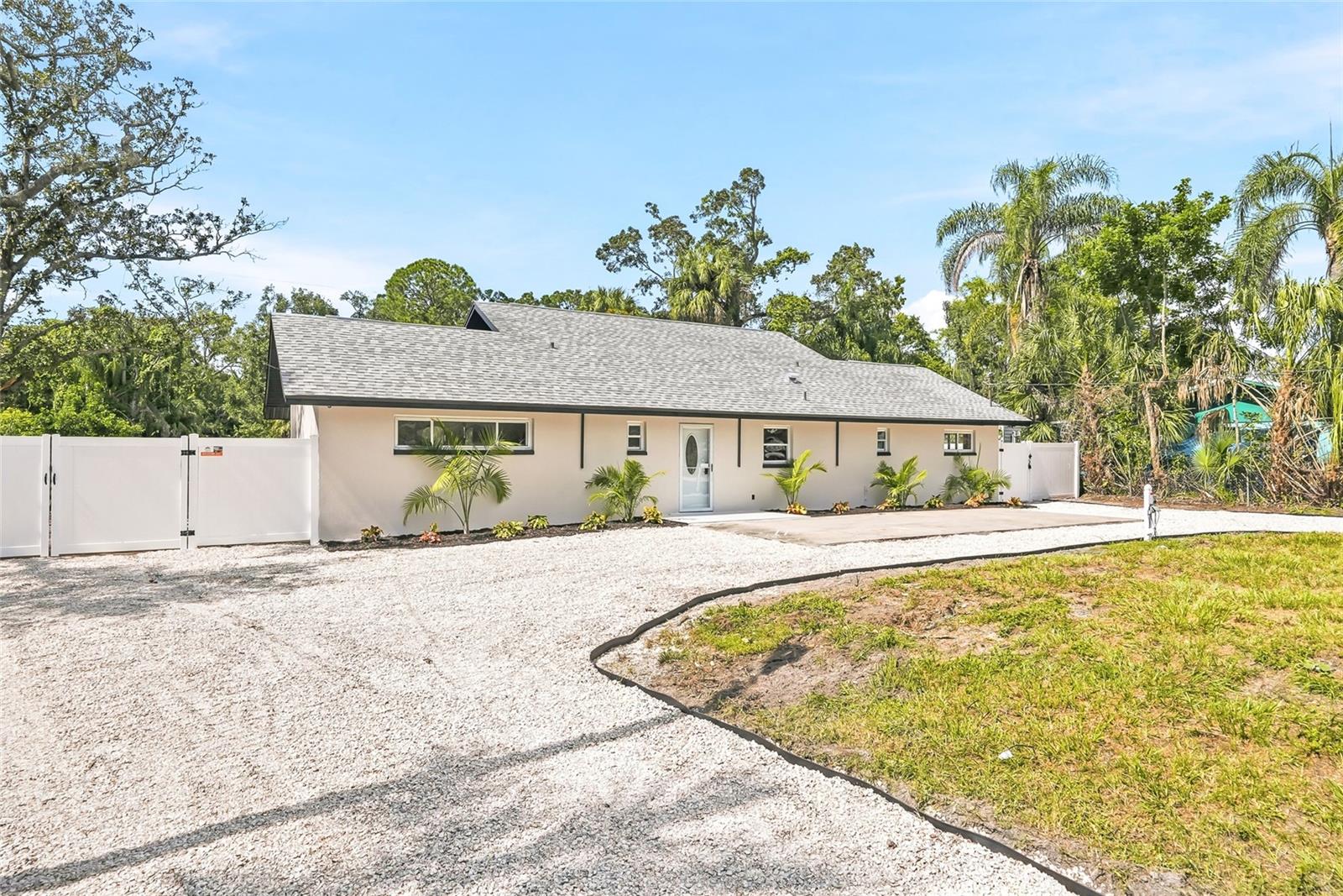 WATERFRONT LIVING JUST MINUTES FROM TAMPA INTERNATIONAL AIRPORT! Beautifully renovated 3-bedroom, 3-bathroom home in desirable Town ’n’ Country, featuring approximately 100 feet of canal frontage and a brand-new 12' x 12' dock. This move-in-ready home offers a new roof, new HVAC, updated electrical, elegant tile flooring, and beautifully remodeled bathrooms. Enjoy an open-concept split floor plan, a stunning kitchen with solid wood cabinets and Taj Mahal countertops, and a spacious backyard with privacy and waterfront safety fencing. Prime location, modern upgrades, and waterfront living—all in one!Here’s a shorter version. Waterfront living minutes from Tampa International! Fully renovated three-bed, three-bath home with about 100 feet of canal frontage, a new 12-by-12 dock, and a spacious fenced yard. Updates include new roof and HVAC, updated electrical, tile floors, remodeled baths, and an open-concept kitchen with solid wood cabinets and Taj Mahal countertops. Move-in ready in prime Town ’n’ Country!
