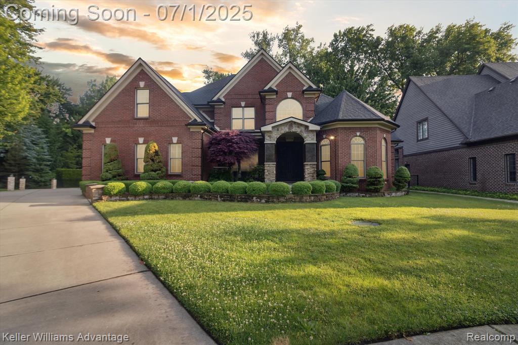 This contemporary home in Harrison Township is an absolute dream with 2,910 sq.ft. of luxurious living space. Beautiful french doors open to the entrance foyer, with cathedral ceilings and a mezzanine window. First floor has a spacious and open layout with tiled floors and stunning light fixtures throughout. Office to the right, with large windows overlooking the front yard and it's own gas fireplace. The foyer opens to the dining room, which features a stunning tiled wall and arched openings. Living room has two-story brick mantel with gas fireplace, high ceilings, and large windows to welcome natural light. Half bath and laundry room on the first floor. Second story overlooks the living room below. Combined kitchen and breakfast nook feature a contemporary design of monochrome granite countertops and backsplash, white cabinetry, and stainless steel appliances. Peninsula island offers bar seating, backing up to the breakfast nook, with it's stunning brick wall and bay windows. Primary bedroom has it's own wing in the house, with it's own gas fireplace, tiled floors, and tray ceiling. Master bathroom is a fantasy with a glass stand up shower and deep soaking tub with gas fireplace. A walk-in closet is accessible through the bathroom. Four additional bedrooms on the second floor - one with it's own full bath, plus a dual-entry full bath. Basement is finished, great as a game room, work out space, or additional living room. A second kitchen with appliances is available, with space for seating. Plus, a wet bar area, great for hosting get togethers and entertaining family and friends. Walk-out access to the backyard, which backs up to a wooded area. Attached two car garage with additional appliances. Backyard has an in-ground pool, multi-level deck, and gazebos for plenty of covered seating. It's the perfect set-up for enjoying Michigan summers. Located east of Anchor Bay, near Mt. Clemens. Schedule your private tour of this luxurious contemporary home today!