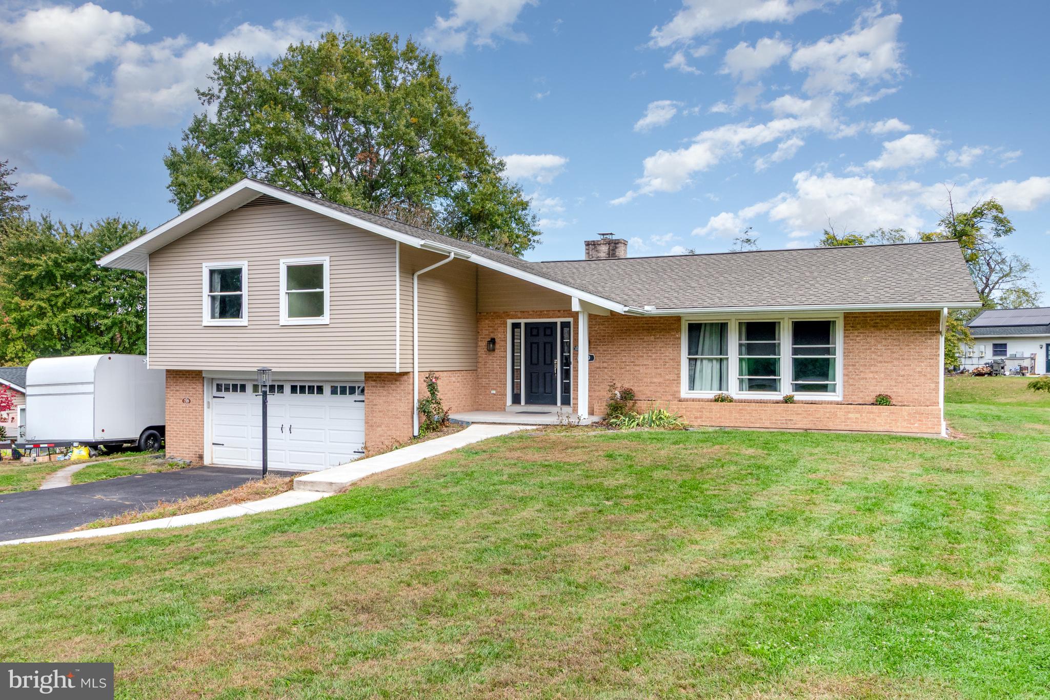 Flexible Split-Level in Derry Township – In-Law Potential! Located just minutes from Hershey Medical Center and steps from scenic walking and biking trails, this South Hills split-level offers a flexible layout and thoughtful updates. Originally renovated by a respected local builder, the home features a warm and inviting kitchen with Woodmont espresso cabinetry, soft-close drawers, granite countertops, stainless steel appliances, and a charming breakfast nook overlooking the backyard. The open-concept kitchen flows into a vaulted living room with a brick gas fireplace and sliding glass doors that lead to a rear patio—perfect for casual gatherings. A formal dining room connects to a spacious family room filled with natural light. Primary suite with walk-in closet, balcony, and tiled shower.  Brand new laundry room addition on the main level for added convenience! The lower level presents an excellent opportunity for in-law quarters or extended guest space, with its own private entrance and layout potential. A two-car integral garage, professionally waterproofed basement with ample storage, and recent mechanical upgrades—including a high-efficiency HVAC system, updated electric panel, and architectural shingle roof—round out the home’s features. Enjoy the charm of Hershey living with distant views of the Hershey Hotel and proximity to the Hershey Community Center. A home with character, comfort, and room to grow. No matter how you look at it  THIS IS HOME!