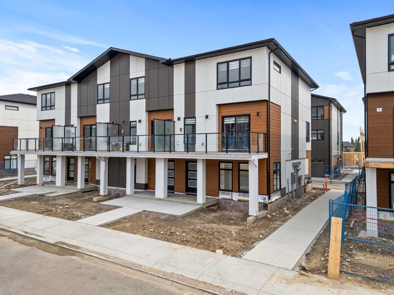 ***Open House Saturday 12:30 to 4:30pm***  Photos are from a similar, completed unit - finishing may vary* Welcome to this beautifully upgraded 4-bedroom, 3.5-bathroom BRAND NEW townhome in the highly desirable community of West Springs. This home has been carefully designed to balance modern style with everyday functionality—perfect for today’s busy lifestyle.

Upon entry, you’re greeted by a bright and versatile foyer space and a bedroom with an ensuite - the perfect space for a home office or studio. This level also provides direct access to the double attached garage, offering ample room for parking and storage.

The second floor features an open-concept layout. The kitchen is beautifully appointed with quartz countertops, a tile backsplash, abundant cabinetry, and brand-new premium appliances. A large island provides additional prep space, making the kitchen ideal for cooking and entertaining. Sliding glass doors lead to a private OVERSIZED balcony with glass privacy panels—a great spot to relax outdoors. A stylish 2-piece bathroom completes this level.

Upstairs, two secondary bedrooms are located at the back of the home—well suited for children, guests, or a quiet workspace. A 3-piece bathroom with under-sink storage adds both convenience and thoughtful design. The primary bedroom creates a relaxing retreat with a large window, oversized walk-in closet with built-in organizers, and a spacious 4-piece ensuite featuring double sinks with quartz countertops, generous cabinet storage, and tiled flooring.

Set in one of Calgary’s most family-friendly neighborhoods, West Springs provides easy access to shopping, dining, schools, and green spaces. A designated high school is just minutes away, and quick connections to Stoney Trail and Sarcee Trail make commuting downtown simple. For outdoor enthusiasts, Canada Olympic Park is a short drive away, offering year-round recreation.

Don’t miss the opportunity to own a stylish, well-appointed home in one of Calgary’s most sought-after communities. Please visit the showhome at 823 821 Street SW for more details!