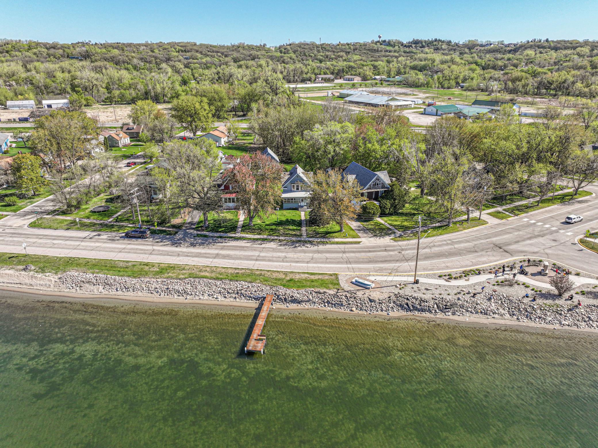 What is better than being on Lake Minnewaska, the ideal location right next to Lake Minnewaska? This lake home is seated right downtown on the edge of the water as one of the historic "Ladies of the Lake" from the early days of Glenwood. This home boasts of turn of the century charm and modern updates, all rolled into a cozy lake getaway.It is suitable for year round use, so if you are looking for a home in Glenwood why not make it a turn of the century charmer. This home has been well loved and cared for and you will see that as you stroll through the home. It's original beauty has been restored. It boasts with 9 foot ceilings, tall baseboards, real wood floors, ornate woodwork. classic staircase, formal dining and living. The upstairs resonates, with panoramic lake views from the primary bedroom, contemporary bathroom with updated tile, spacious bedrooms with large walk-in closets loaded with natural light. Whether you are looking for a lake home or a your year round home, this gem is sure to please. Updates include: recently refinished hardwood floors throughout, newly painted exterior in summer of '25, and many updates in 2018, including the new detached garage and re-plastering the walls and ceilings, refinished radiators.