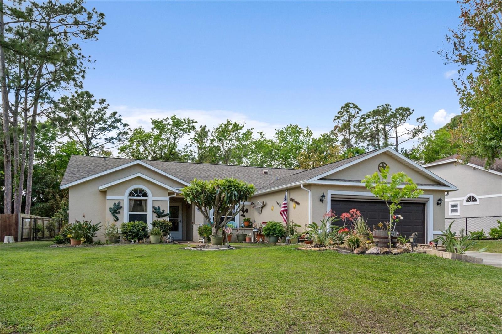Spacious and well-maintained 3-bedroom, 2-bath home with 1,896 sq. ft. of living space! Enjoy Florida living with an electric pull-up garage screen (installed 2022), and a Florida room for extra relaxation. The kitchen boasts granite countertops, oak cabinets, a pantry, and a fire door (2021) leading to the garage. The owner’s suite features a 10x10 walk-in closet, a Jacuzzi tub, and a separate tub/shower.
Recent upgrades include a new roof and skylight (2021), , a water heater and shower valve (2022), and a generator outlet (2024). The guest bath offers a tiled shower, and window balances and sash slides were updated in 2021. Vaulted ceilings enhance the spacious feel of this home. The garage has a new LiftMaster opener, door, and cables (2022).Air conditioning unit newly installed as of June 2025, with a 10-year warranty included.
Step outside to a beautifully landscaped yard with a 10x10 gazebo, an oversized shed, and two extra gates on the fenced backyard. Plus, a well for keeping the yard green!  This home is high and dry! Close to the beach, stores, schools and the many miles of walking paths throughout Palm Coast. Don’t miss out on this gem!