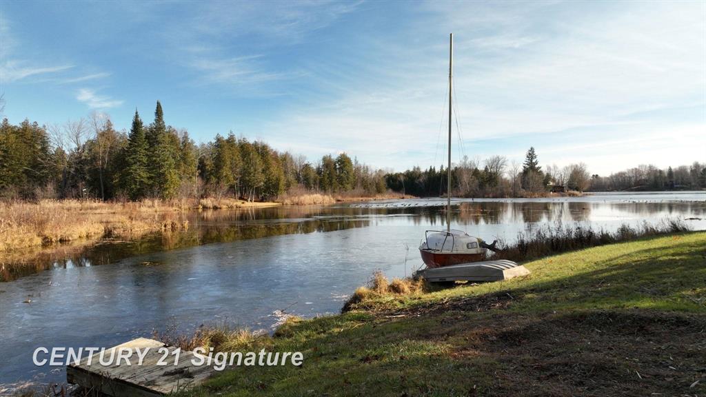 Escape to Your Own Waterfront Retreat on No-Wake McGilvery Lake! Discover a rare opportunity to own 2.61 acres of pristine waterfront property on peaceful McGilvery Lake in Gladwin, Michigan-complete with your very own private island. This charming 3-bedroom, 2-bathroom home blends up-north serenity with comfortable year-round living, making it the perfect getaway or full-time residence. Property Highlights- 2.61 Acres on a No-Wake Lake "“ Enjoy quiet mornings, wildlife views, kayaking, fishing, and breathtaking sunset paddles on one of Gladwin's most serene lakes. Private Island "“ A truly unique feature offering endless potential for picnics, camping, entertaining, or simply enjoying unmatched privacy. Inside you'll find 3 Bedrooms, 2 Full Bathrooms, a functional and inviting layout with warm natural light and scenic views from nearly every room. Relax in the spacious living area, gather around the big picture windows and take in the tranquil waterfront backdrop and swans beyond your backyard.The open kitchen is perfect for cooking and entertaining, with easy flow to the dining area and outdoor living spaces. Expansive outdoor areas have a gentle sloping yard to the water, mature trees, space for gardens, and plenty of room for lakeside activities. The driveway is long and the road is tree lined for maximum privacy and peace of mind.  Whether you're seeking a year-round home, a vacation retreat, or a nature-lover's sanctuary, this one-of-a-kind property offers the privacy, space, and beauty rarely found on the market. Wake up to the sound of the breeze on the water, spend your afternoons exploring your island, and enjoy evenings under star-filled skies. Your waterfront lifestyle begins here-schedule your private showing today.