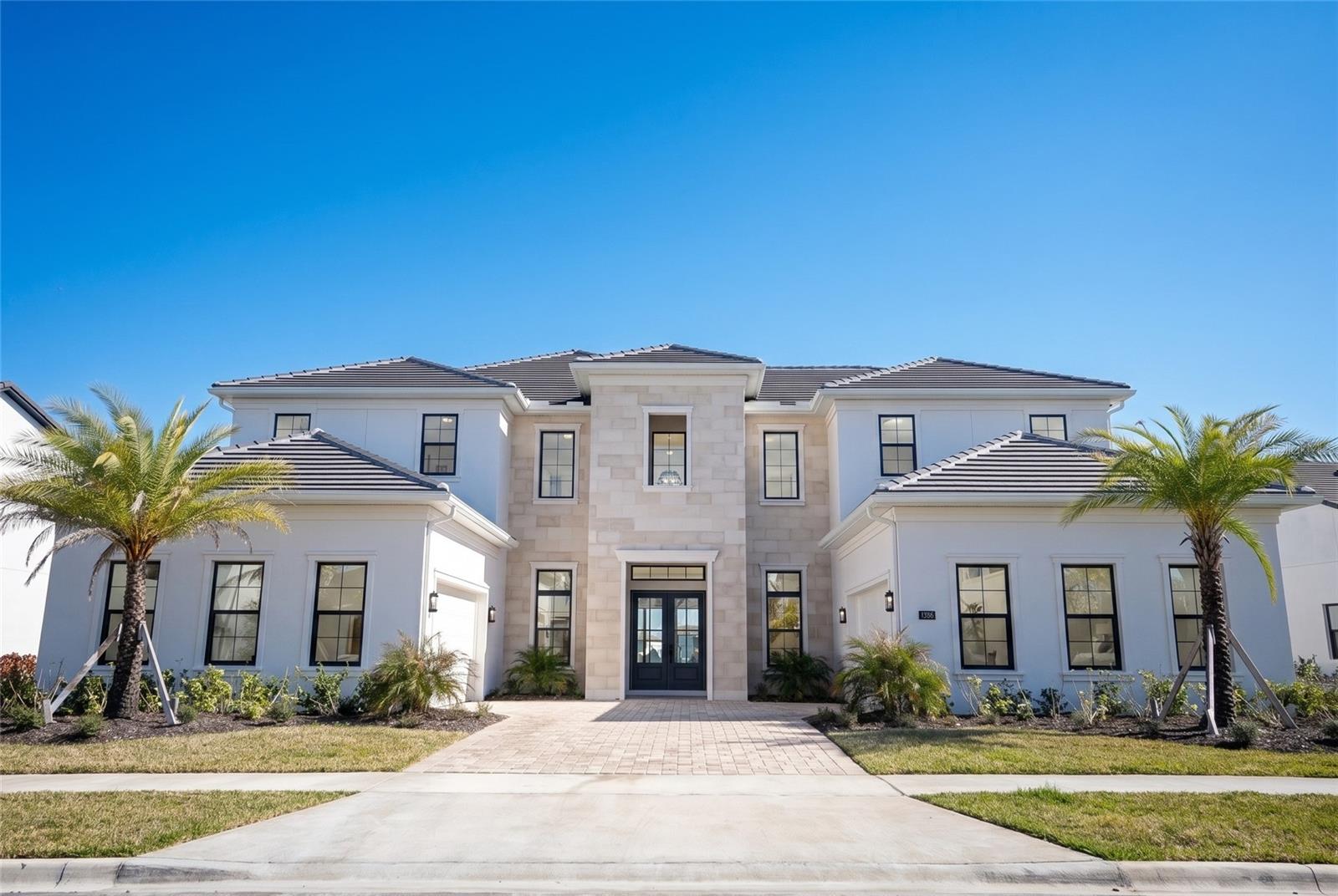 One or more photo(s) has been virtually staged. Introducing an extraordinary Toll Brothers lakefront masterpiece in the exclusive gated enclave of Laurel Pointe at Lake Nona.Positioned on a premium waterfront homesite with a Northeast-facing front and a Southwest-facing backyard, this residence is perfectly oriented to capture soft morning light at the entrance and stunning afternoon sun over the lake, creating breathtaking golden-hour reflections across your future outdoor living space.Spanning 6,632 square feet of contemporary elegance, this newly built estate showcases soaring ceilings, striking architectural lines, and an abundance of natural light throughout, with no carpet anywhere in the home. Every detail was curated for refined modern living.Featuring 5 spacious bedrooms, a dedicated cabana bath ready for future pool enjoyment, and two private office spaces, one downstairs and one upstairs, this home was designed for today’s lifestyle. Whether managing business remotely, hosting executive meetings, or creating family memories, the layout offers both productivity and privacy.The open-concept design flows seamlessly into a covered lanai overlooking serene lake views, where Southwest exposure enhances your afternoons with warm, inviting sunlight ideal for entertaining, relaxing, or designing the ultimate outdoor retreat.At the heart of the home, the chef’s kitchen impresses with premium appliances, an oversized island, sleek custom cabinetry, and designer finishes, all opening to expansive dining and living areas that elevate both everyday living and large-scale gatherings.The primary suite is a private sanctuary with tranquil water views and a spa-inspired bath featuring a freestanding soaking tub, oversized glass shower, dual vanities with smart mirrors, and curated luxury finishes.Additional highlights include a private theater room for cinematic evenings, energy-efficient systems, dual 2-car garages, and generous storage throughout.Located in Lake Nona’s innovative master-planned community, residents enjoy proximity to Medical City, USTA National Campus, Orlando International Airport, and premier dining and shopping, all within one of Central Florida’s most forward-thinking neighborhoods.This is more than a home.It’s a statement of lifestyle, design, and position.Schedule your private showing today and experience elevated lakefront living at its finest.