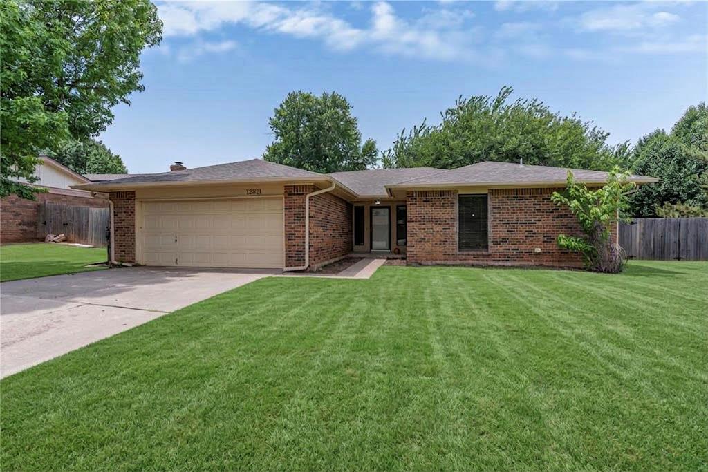 Perfectly situated on an oversized corner lot in an established Northwest Oklahoma City neighborhood, this charming 3-bedroom, 2-bathroom home offers a beautiful blend of comfort and convenience. Large windows flood the spacious living room with warm, natural light, highlighting a classic brick fireplace that serves as a cozy focal point. The functional kitchen layout provides plenty of cabinet and storage space, making meal prep a breeze. Retreat to the private primary suite, complete with a generous walk-in closet and a bath featuring double vanities. Outside, the large fenced-in yard and covered patio create a perfect backdrop for weekend barbecues or relaxing in the shade, while the attached two-car garage provides extra security and storage. Located just minutes from the Kilpatrick Turnpike, Lake Hefner, and top-tier shopping and dining, this NW OKC gem offers unbeatable location and lifestyle—reach out today to schedule your private tour!
