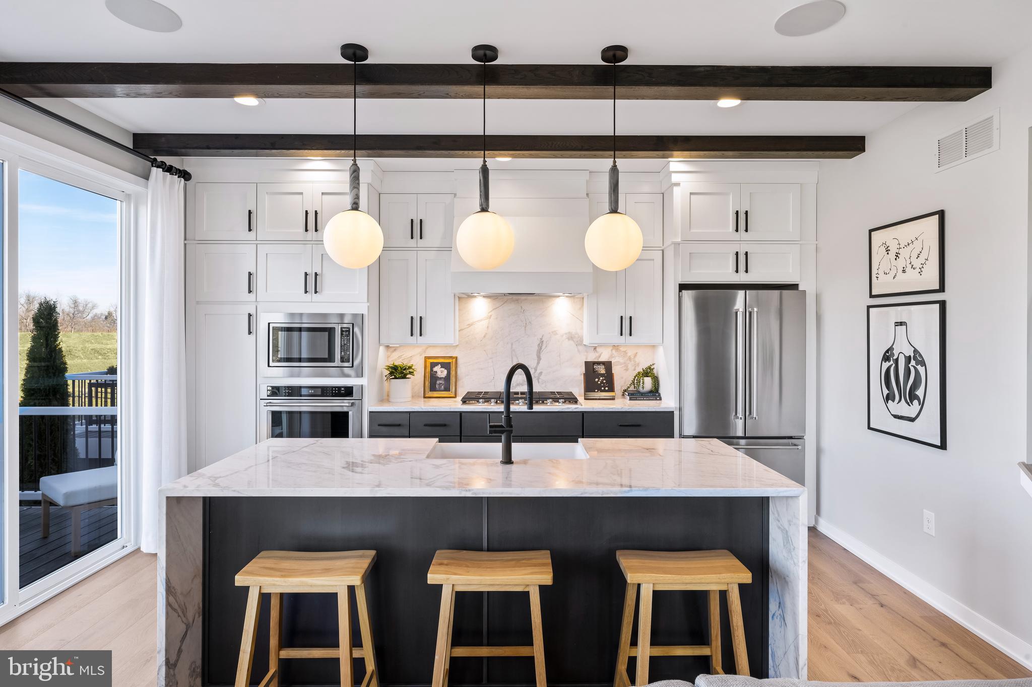 Experience contemporary design in a versatile living space with this quick move-in home. Tall windows in the great room allow for an abundance of natural light. The open-concept living space, highlighted by a beautiful great room and casual dining area, is perfect for hosting friends and family. A well-equipped kitchen features a center island with a breakfast bar, ample counter and cabinet space, as well as a sizable pantry. Experience the luxury you've always wanted by scheduling a tour today. This home includes the Designer Appointed features and will be ready by September!