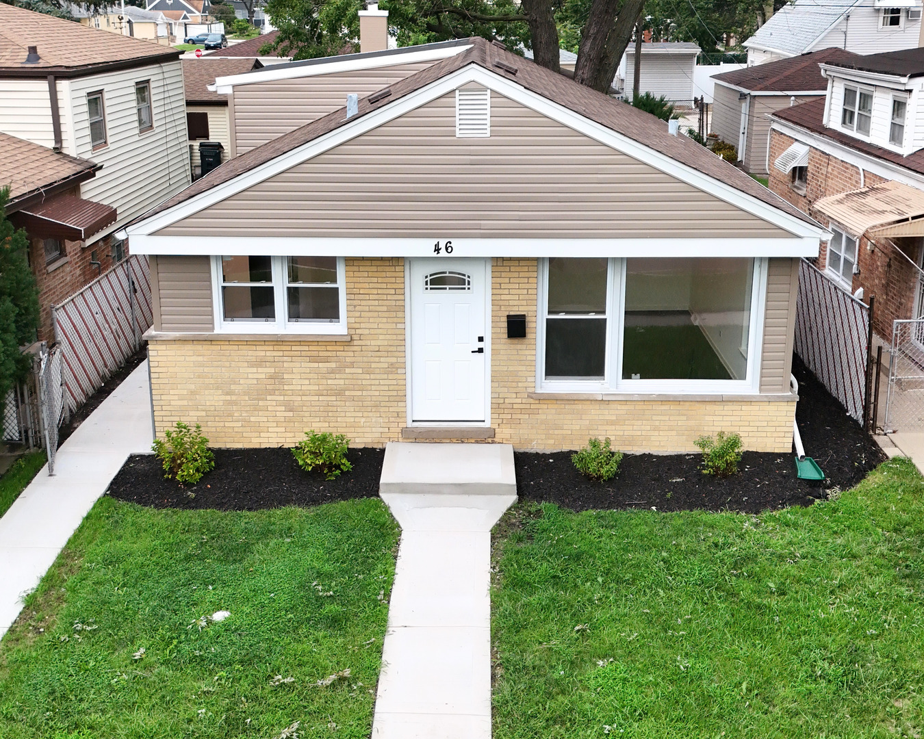 Welcome to this beautiful completely rehabbed gem at 46 Hyde Park in Bellwood!  Featuring 3 generously sized bedrooms-2 on the main floor and a private retreat upstairs-this home offers both functionality and style. The updated full bathroom on the main level is fresh and modern. Step into the fully remodeled kitchen, complete with brand-new cabinetry and sleek black appliances. The home also includes a finished half-basement, ideal for a rec room, home office, or added living space. Exterior highlights include new siding, a newer roof (just 2 years old), and a detached 2-car garage. Turnkey and ready for its new owner-schedule your tour today!