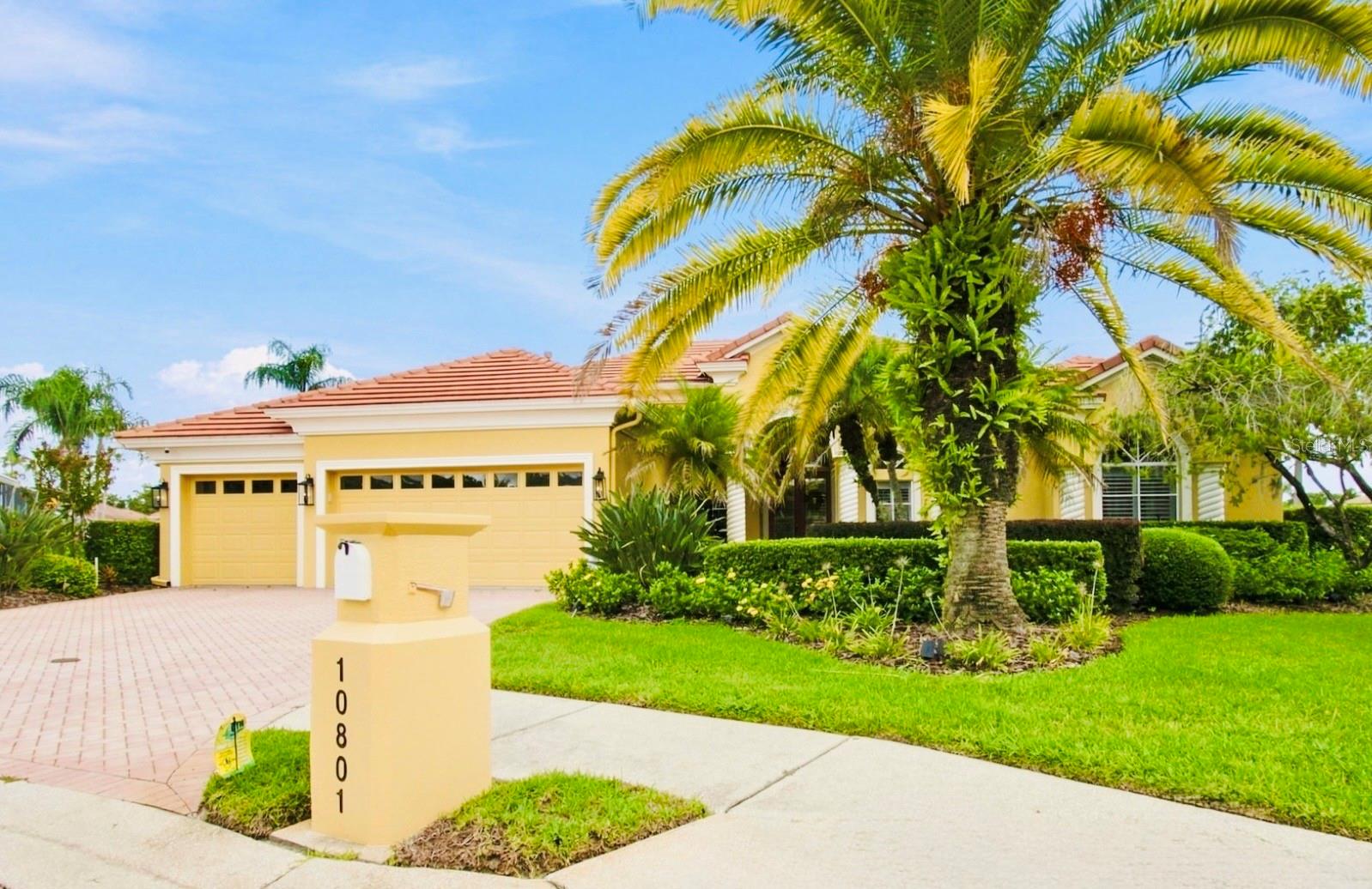 Waterfront Grandeur; Set in the tranquil community Cory Lake Isles, this residence delivers more than 4,100 square feet of refined waterfront living in one of New Tampa’s premier gated communities.Positioned on approximately half an acre at the end of a cul-de-sac, the residence makes an elegant first impression with its tile roof, tropical landscaping, paver driveway and three-car garage. Beyond the entrance inside, soaring ceilings, expansive windows and generous architectural details fill the home with natural light while maintaining a sense of warmth and intimacy.At the heart of the residence is a gourmet kitchen designed for both inspired cooking and effortless entertaining. Rich wood cabinetry, expansive countertops, stainless-steel appliances, double wall ovens, a statement vent hood and an oversized island create a polished culinary setting. An adjoining breakfast area frames beautiful views of the pool and lake, turning everyday mornings into something extraordinary.The primary suite offers a private retreat opposite the main areas, with direct access to the outdoor living areas, a spacious custom-fitted wardrobe and a spa-inspired bathroom featuring a jetted soaking tub, glass-enclosed shower and dual vanities. Three additional bedrooms and beautifully appointed living spaces provide exceptional flexibility for family, guests and features a private home office.Upstairs, the dedicated theater creates an immersive setting for movie nights and sporting events. With an adjacent full bathroom, the space may also serve as a fifth bedroom, guest suite or private retreat.Florida living reaches its finest expression outdoors. The expansive screened lanai surrounds a private pool and spa, while a built-in outdoor kitchen and multiple gathering areas invite year-round dining and entertaining. Beyond the pool, the lawn descends toward the lake and a private dock—offering a peaceful setting for boating or simply watching the water drift by.Residents of Cory Lake Isles enjoy 24-hour guarded access, a community pool, fitness center, tennis courts, parks, playgrounds, a private boat ramp and extensive recreational access to the lake.What's more?  Whole House Generator, Whole House Water Filtration Sytem and EV charging.  With four bedrooms, four full bathrooms, flexible fifth-bedroom accommodations and 4,154 square feet of interior living space, this exceptional residence offers the scale, privacy and waterfront lifestyle expected of a million-dollar address.