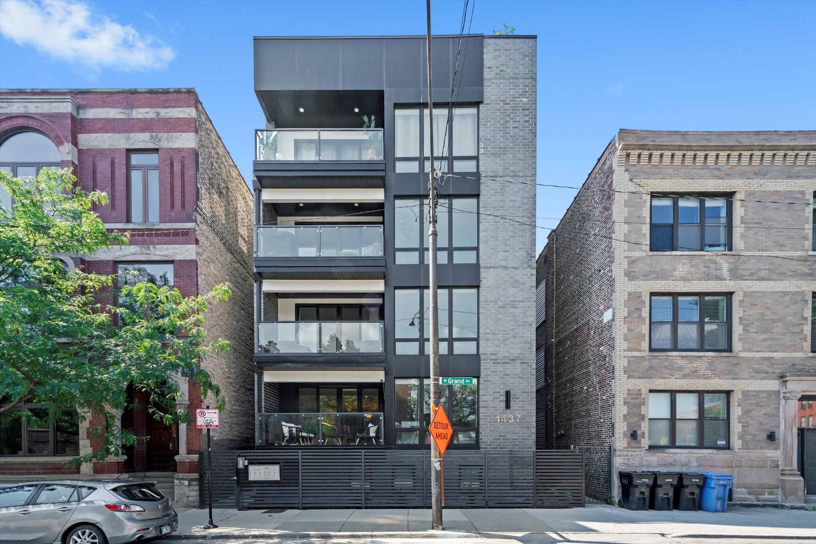 Impeccably designed and thoughtfully appointed, this stylish West Town duplex down offers the perfect balance of luxury and functionality. With designer finishes, custom closets, elegant window treatments, and curated lighting throughout, every detail has been considered. The expansive main level showcases wide-plank white oak flooring, soaring floor-to-ceiling windows, and a sleek powder room. A spacious bedroom with upgraded glass French doors offers flexible space for a guest room or home office.    The open-concept chef's kitchen is a showstopper, featuring a premium Bertazzoni appliance package, custom cabinetry, dramatic 3" waterfall quartz countertops, wine fridge, and Studio 41 fixtures-ideal for entertaining or everyday living.    On the lower level, you'll find Lifeproof flooring, generous storage, side-by-side laundry, and three oversized bedrooms all on one level, including a stunning primary suite. The spa-inspired ensuite bath includes heated floors, dual floating vanities, an oversized steam shower, freestanding soaking tub, and a private water closet.    Enjoy multiple outdoor spaces including a private rear deck and a beautifully furnished garage roof deck-shared with just one other unit. Garage parking is included.    All of this in a prime West Town location, with easy access to Fulton Market, West Loop, River West, and convenient transit options for a quick downtown commute.