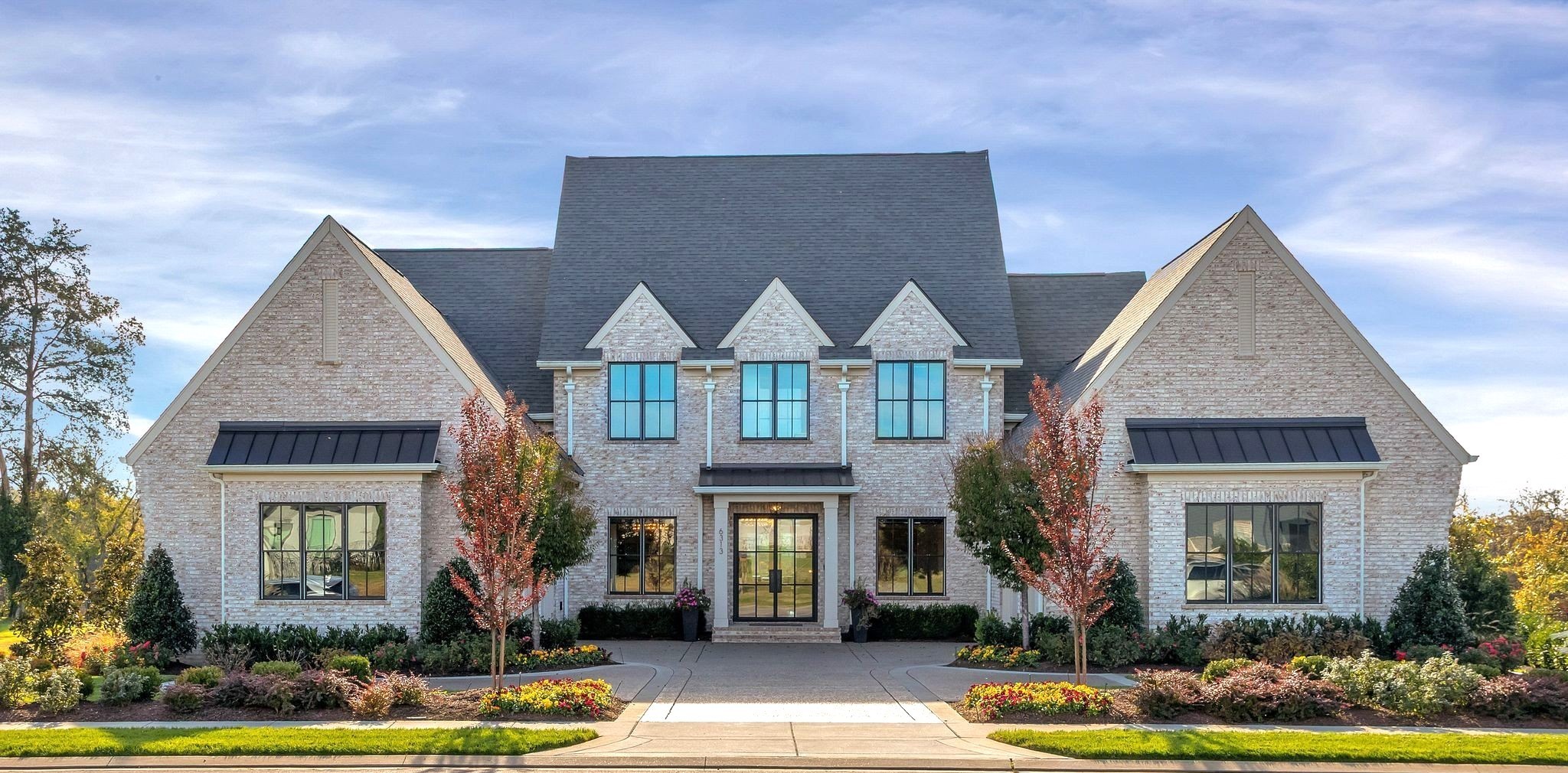 Discover architecturally refined luxury in prestigious Hardman Springs, perfectly positioned backing to private common space with breathtaking sunset views and a rare sense of serenity. Thoughtfully designed with soaring 12' ceilings down, 10' ceilings up, hardwoods throughout main living areas, designer finishes, electric shades, and exceptional craftsmanship at every turn. Gourmet kitchen and elegant entertaining spaces flow seamlessly into resort-style outdoor living centered around a stunning 20x50 gunite pool and spa. The additional 1,009 sq ft pool house showcases travertine flooring, dramatic fireplace, electric shades, and exceptional gathering space ideal for luxury entertaining or private guest accommodations. Rare 491 sq ft climate-controlled attic with Magic Lift access offers exceptional convenience and storage. A sophisticated blend of architecture, privacy, and elevated luxury living.
