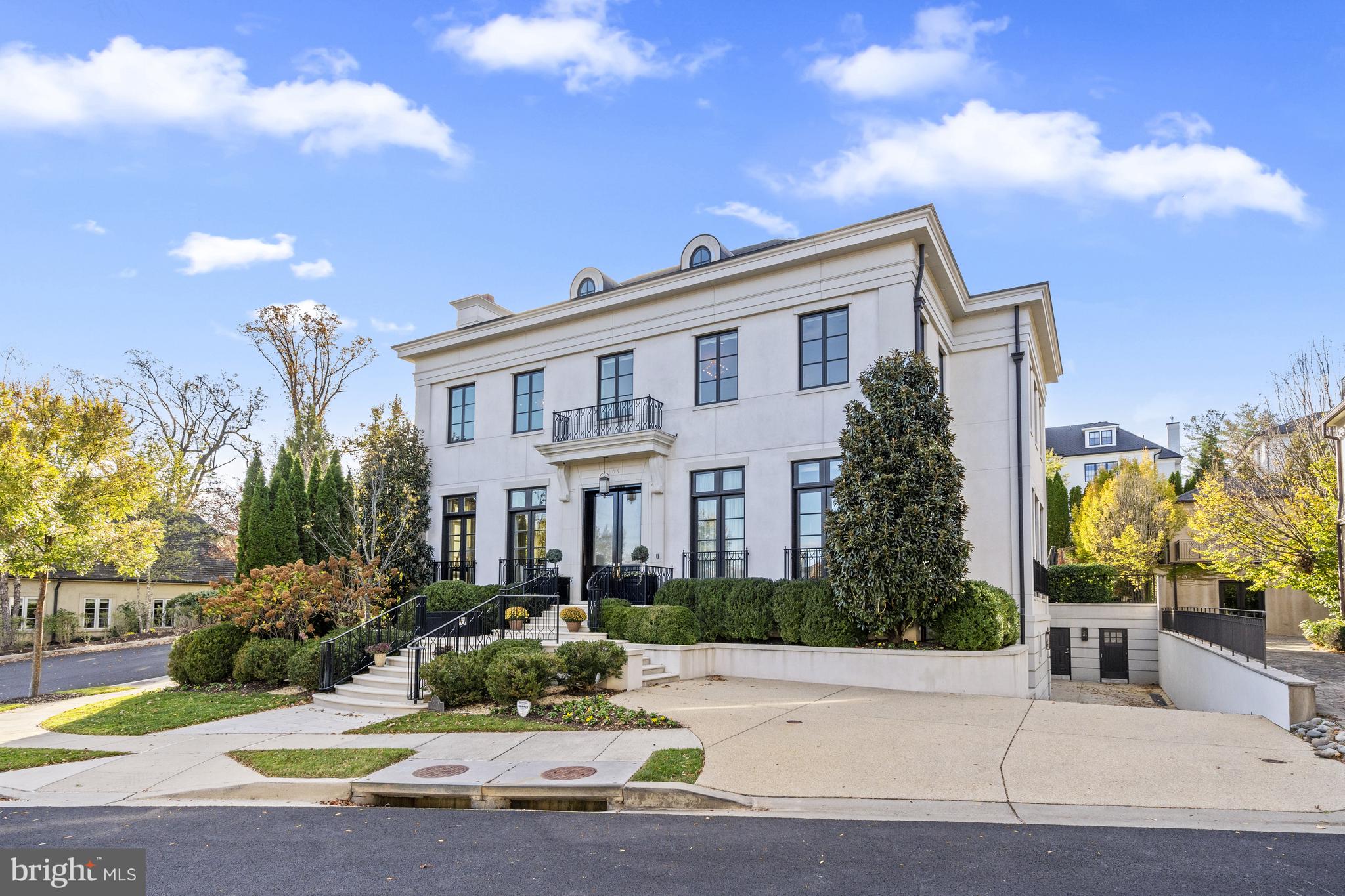 An architectural masterpiece exuding style, elegance and grandeur this magnificent stucco and limestone residence with approximately 10,700 SF of exquisitely finished living space  impresses at once with its imposing regal façade prominently situated to command attention in the prestigious enclave of Phillips Park. Designed by the renowned architectural firm of Barnes -Vanze and constructed by the acclaimed Gibson Builders  every inch has been painstakingly thought out to display a subtle beauty both inside and out. The home was built in 2013 and in 2024 was  renovated, fine tuned and decorated to perfection. This 5- bedroom, 5 full bath and 4 half- bath home is one of the largest homes in Phillips Park and features the highest quality finishes and was created with both grand scale entertaining and comfortable family living in mind.Gently rising limestone stairs provide a sublime introduction for entry to the home where, once inside, a circular vestibule with scalloped accent walls leads to a dramatic 35 -foot long, wide gallery with 11- foot ceilings with a view to the private rear garden. The main floor features large principle rooms wonderful for entertaining and is perfectly designed to allow for an effortless flow. A spacious reception room with floor-to- ceiling windows, sleek marble fireplace and a semi-circular bar with an escalloped marble base mirroring the detail of the entry vestibule seamlessly connects with a banquet sized dining room perfect for the most elegant of dinner parties. From the dining room a wide double door leads to a stunning step-down living room with its 12- foot ceilings, marble fireplace and massive walls of floor-to-ceiling windows and French doors providing easy access to the rear garden. A spacious gourmet kitchen with center island includes Miele, Subzero and Wolf stainless steel appliances and opens to an adjacent and bright breakfast room with banquette seating. The main floor continues with a generously sized home office, cozy den and two powder rooms.An elegant circular staircase ascends to the second level  boasting 11-foot ceilings and providing access to 4 large bedrooms and 4 full bathrooms. The spacious primary bedroom features a luxurious marble primary bathroom with separate water closets and an over-sized custom walk-in-closet.  A second bedroom with en-suite bathroom includes a second room- sized custom walk-in closet. Two more large guest bedrooms each with en-suite bathrooms along with a laundry room complete this floor.The lower-level seduces with an intimate lounge /media room featuring surround sound, separate wet bar and adjacent powder room. This level also includes a large bedroom with en-suite bathroom and walk-in-closet, laundry room, and is connected to a two-car garage. An additional sub lower- level leads to a spectacular, fully equipped state-of-the-art gym.A tranquil and private rear garden features lush and evergreen mature plantings and provides ample room for grand scale outdoor entertaining on an expansive limestone patio which steps up to a shimmering swimming pool and jacuzzi, complete with separate pool house with powder room. Additional amenities include a commercial -grade elevator servicing all floors, Sonos sound system,  state of the art security cameras and security system, numerous smart home features and applications,  a generator plus various other luxury conveniences. This extraordinary residence is being offered as a “turn-key” fully-furnished property (art ; objet d’art excluded).