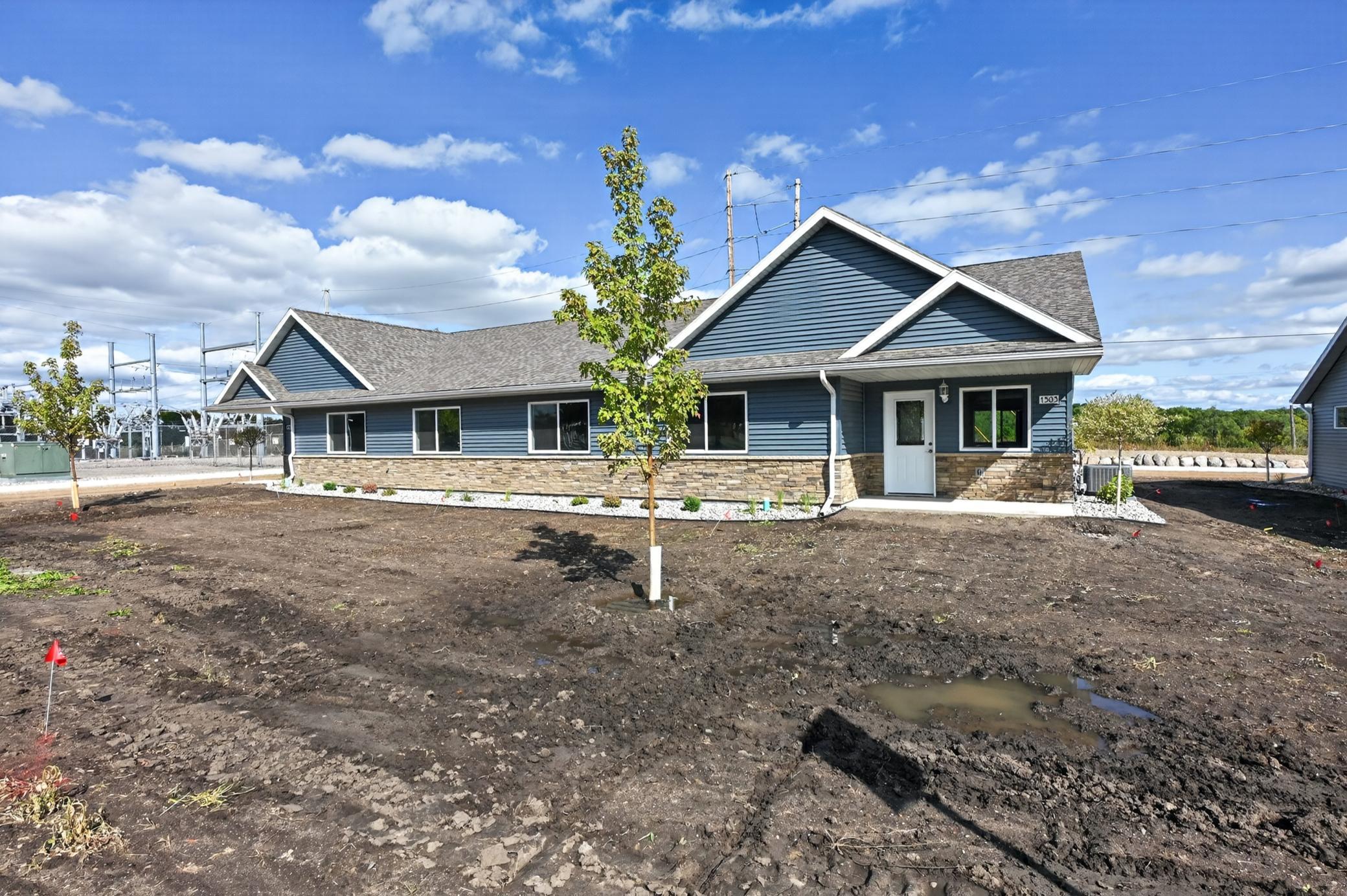 NEW CONSTRUCTION + AFFORDABLE HOMEOWNERSHIP! Don’t miss this opportunity to own a brand-new 2-bedroom, 1½-bath townhome featuring an inviting open floor plan, city water and sewer, and a 2-stall attached garage. Enjoy easy living with lawn care, snow removal and garbage included in the association dues. Plus, with available secondary financing, there is an opportunity for qualified buyers to have a loan amount on this property as low as $282,900, subject to buyer qualification and lender approval. Close to downtown, shopping and schools, this could be the opportunity you’ve been waiting for to make homeownership a reality! All buyers must meet applicable income guidelines.