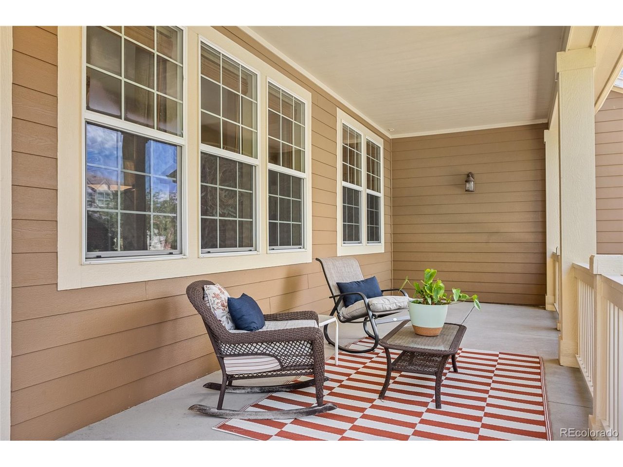PRICE REDUCED! The Village of Five Parks is an award-winning subdivision in northwest Arvada, named for the five large, well-maintained parks woven through it. Meiklejohn Elementary and Ralston Valley High School serve the area, and the Boulder Turnpike is minutes away, putting downtown Denver, Boulder, and the foothills all within easy reach.This is the Tahoe model from the Monogram Series - 2,860 finished square feet across two stories, set behind an extended front porch, wide and open, and the kind that actually gets used. Three bedrooms, three baths, and a loft that works as an office, a media room, or a place for guests to land. Vaulted ceilings in both the living room and the family room keep the main level bright and open.A three-car garage handles the cars, the gear and the storage, and the mud and laundry room sits just off it, so wet boots and groceries stop there instead of in the rest of the house.Out back, a custom post and beam pergola anchors an open, well-maintained yard.Recent updates include a new dishwasher, new window coverings and curtains, freshly painted fencing, and a brand-new storm door at the back entry.At 4,334 total square feet, roughly 1,400 sit unfinished below - with 10-foot ceilings, which makes it a real opportunity rather than a storage room. Room for whatever comes next.