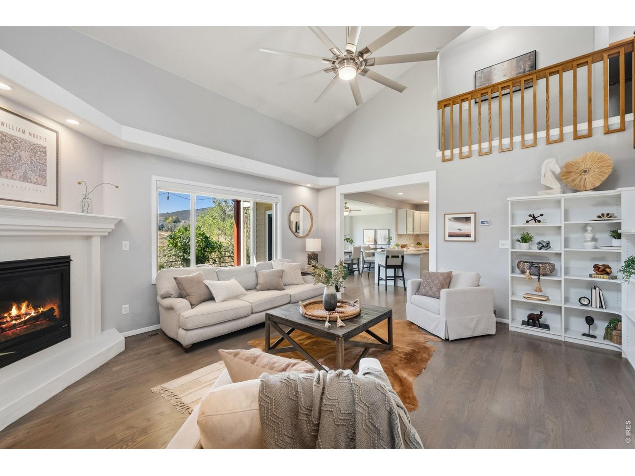 Set against the open space and foothills of The Ponds, this west Fort Collins home makes the most of a setting that's hard to replicate. Trails wind right through the neighborhood, Horsetooth Reservoir is just minutes away, and the iconic CSU "A" is part of the view from home. There are plenty of places to enjoy it all, from the covered back patio to the private deck off the primary bedroom, perched above the open space with sweeping foothill views. Inside, a soaring 2-story living room brings in abundant natural light. Fresh interior paint, refinished hardwood floors and LVP throughout much of the home create a clean, cohesive feel. The kitchen has been refreshed with painted cabinetry, an updated tile backsplash and stainless appliances. Upstairs are three bedrooms, including the spacious primary suite with its own private deck. The finished basement adds another layer of flexibility with a bedroom, 3/4 bath, living area and kitchenette, plus a separately secured entrance and lockable separation from the main home. It's a setup well suited for multigenerational living, extended-stay guests, a private work space, or simply having room to spread out. With multiple outdoor living spaces, a finished basement and open space just beyond the backyard, this home offers room to live, room to gather and an everyday connection to the foothills that makes The Ponds such a special part of Fort Collins.