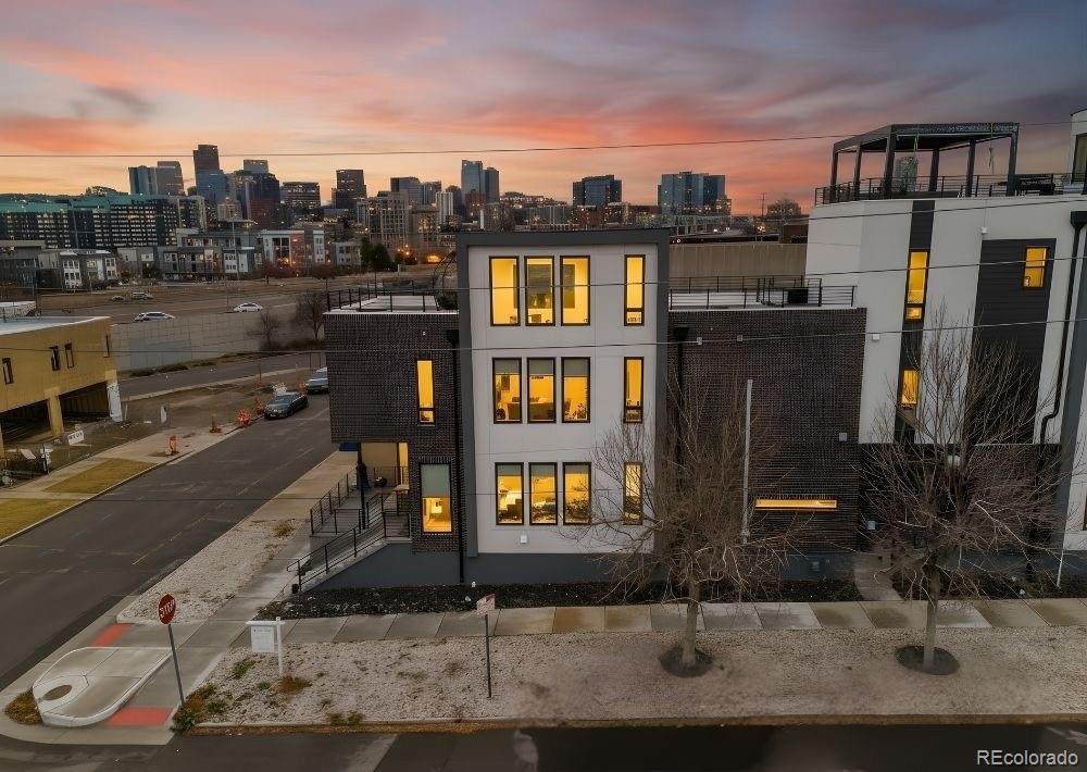 Step into luxury from the moment you walk in & all the way throughout! Experience modern city living at its finest in this stunning, newer-construction 3-story duplex located in the heart of Denver’s ever so sought after Highlands. Thoughtfully designed and custom built, this contemporary home blends sleek architecture with upscale comfort and unbeatable convenience. Enjoy breathtaking panoramic city views from each bedroom as well as from your private rooftop terrace—perfect for entertaining, relaxing, or taking in unforgettable sunsets! Inside, the open-concept layout is filled with natural light, high-end finishes, and modern design details throughout, creating a sophisticated yet inviting atmosphere. Situated just steps from the city’s best fine dining, craft cocktails, nightlife, and entertainment, this location offers the ultimate urban lifestyle. With quick and easy access to all major sports ballparks & arenas, as well as ride share stations & major highways, commuting and travel are effortless while still enjoying the energy of downtown living from the quiet comfort that only the Highlands can offer! This is a rare opportunity to own a beautifully crafted one-of-a-kind home in one of the most desirable and vibrant neighborhoods—where luxury, location, and lifestyle come together seamlessly.