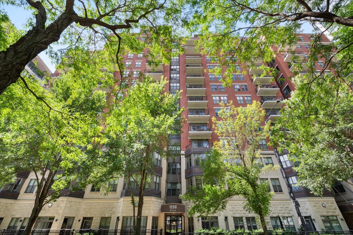 Exceptional corner 3 bed, 2 bath TERRACE residence at Lakeside on the Park in outstanding S. Loop location! First time on the market and sure to impress with a perfect floor plan featuring over 1700 sq. ft. of open living space with breathtaking LAKE views. Large foyer welcomes you to an expansive living room with fireplace that seamlessly connects to kitchen with dedicated space for dining. Patio doors lead to serene terrace with views of the lake & Navy Pier. Kitchen equipped with gas cooking, granite counters, stainless appliances & large island with seating for 4. Hallway off foyer leads to private bedroom wing with Primary bedroom suite & 2nd bedroom. Primary bedroom overlooks the lake, easily accommodates king size bed with nightstands & dresser and offers walk-in closet + wall of closets. En-suite bath with oversized frameless glass shower with body sprays & bench + extra-long vanity & linen closet. 2nd bedroom with room for queen bed also has beautiful lake views. Large 2nd bath with oversized shower, frameless glass, rain head + extra-long vanity & additional closet. 3rd bedroom off living room currently being used as office. So much additional storage in this condo with coat closet + huge walk-in closet in bedroom hall with custom Elfa organizers. Very RARE additional deeded storage room approx. 5 x 10 with very high ceiling + cage storage included - located on main floor of BLD. New crisp white paint throughout this light, bright, airy and open property that has been lovingly maintained. Additional features include new full-size stacking washer/dryer in-unit, Hunter Douglas electronic blinds in Living Room & Primary Bedroom. Lakeside on the Park is perfectly located and offers residents on-site property manager, landscaped courtyard, sun deck, gym and very reasonable assessments! Premium location with easy access to CTA/EL, Roosevelt, LSD, Museum Campus, Soldier Field, Grant Park + great shopping & restaurants + top rated school South Loop Elementary. 2nd floor attached deeded garage parking offered for $30K.