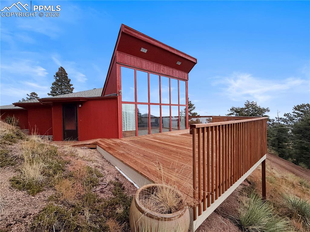 Fantastic Crystal Park Rancher with Panoramic Views. Discover this unique custom rancher nestled in the prestigious gated community of Crystal Park, a stunning 2,000-acre mountain enclave just outside Manitou Springs. Offering the perfect blend of peaceful rural living, privacy, and convenient access to Manitou Springs and Colorado Springs, this home delivers the Colorado mountain lifestyle at its finest. The bright, open main floor plan features a spacious living room and kitchen that flow seamlessly together, filled with natural light from expansive windows designed for passive solar heating. Three generous bedrooms, two bathrooms, and a dedicated office provide flexible living space. A wood-burning stove adds cozy warmth for those crisp Colorado winter evenings, while the large deck is perfect for enjoying breathtaking panoramic mountain views. Additional highlights include: Energy-efficient passive solar design, Private well with backup cistern, and single-level rancher layout. Crystal Park Amenities include a manned security gate, a community clubhouse with a full kitchen for events, a heated swimming pool (summer), tennis courts, pickleball courts, a stocked trout pond, miles of private hiking trails, and community road maintenance. This rare combination gives residents a true sense of seclusion and nature while being just minutes from town. This is a truly one-of-a-kind home in one of the most sought-after private mountain communities in the Pikes Peak region. Whether you're looking for a peaceful retreat or a unique forever home, this property offers it all. Don’t miss this exceptional opportunity in Crystal Park! Buyer is responsible for any septic inspections
