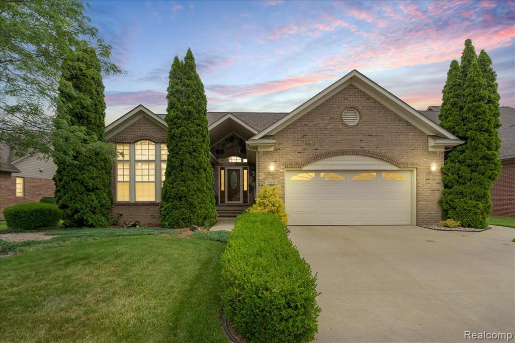 Charming Ranch in Prairie Creek Village! Come check out this beautifully maintained 3-bedroom, 3-bath brick ranch located in the highly sought-after Prairie Creek Village subdivision! From the moment you arrive, you’ll notice the curb appeal, featuring a welcoming covered front porch and updated entry door. Step into a spacious foyer with a striking tin ceiling, and take in the bright, open floor plan with 10-foot ceilings and crown molding throughout. The great room offers a cozy gas fireplace, and flows effortlessly into the dining area and a large kitchen with ample cabinetry, soft-close cabinets and drawers, and even a second oven—perfect for entertaining or family gatherings. The primary suite features a generous walk-in closet and a luxurious en-suite bath with both a walk-in shower and a deep soaking tub. A large first-floor laundry room adds convenience, and all appliances are included! The finished basement is a true showstopper—featuring a huge rec room, a dedicated workout room with mirrored walls, and a dream workshop for any hobbyist or craftsman. But the fun doesn’t stop there—behind one of the doors, you’ll discover a cozy log room retreat, offering that “up north” vacation vibe without the 3-hour drive! The insulated garage includes a large attic storage area with pull-down stairs, adding even more space and functionality. Step outside into the fully fenced backyard and enjoy the incredible 29’ x 15’ raised brick patio complete with a pergola and pull-down shades—ideal for relaxing or entertaining. Don’t miss the adorable “she shed,” perfect for gardening, crafting, or just unwinding. This home is beautifully landscaped front and back, and comes with a full sprinkler system. The roof is only 6 years old, adding extra peace of mind. Enjoy all the perks of living in Prairie Creek Village, including walking trails and a community park. Don’t miss this opportunity to tour a truly unique and beautifully upgraded home—you won’t be disappointed!!!