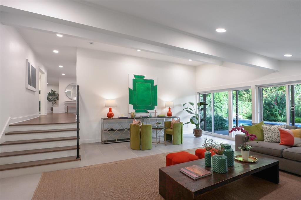 Experience the pinnacle of modern living in this meticulously renovated one-story home located in Fort Worth’s prestigious Overton West Addition. Situated on nearly half an acre, this 3,201 sq. ft. residence has been completely redesigned, blending timeless elegance with contemporary updates and high-end functionality. Step inside to discover an open-concept layout filled with natural light, brand-new rich hardwood floors, and designer finishes throughout. The spacious living room features a modern, updated fireplace and custom wine nook, flowing seamlessly into a state-of-the-art chef’s kitchen with commercial-grade appliances, granite countertops, a large center island, pot filler, built-in refrigerator, and walk-in butler’s pantry. It’s the ideal space for entertaining and everyday living. The private primary suite serves as a true retreat, boasting a spa-inspired bathroom with dual vanities, granite countertops, a separate shower, and a custom closet system. Three additional bedrooms each feature walk-in closets and ensuite or updated baths, offering both style and convenience. A dedicated home office and oversized game room provide versatile spaces for work or play. Outdoors, enjoy a resurfaced gunite pool and spa, mature landscaping, and a large covered patio perfect for gatherings. The gated driveway leads to a three-car covered carport, and above it sits a 600 sq. ft. climate-controlled bonus space, fully finished with updated flooring and paint—ideal for a private studio or creative retreat. Zoned to the highly rated Overton Park Elementary and just minutes from premier shopping, dining, and entertainment, this move-in-ready Overton West home combines modern design, comfort, and convenience in one of Fort Worth’s most desirable neighborhoods.