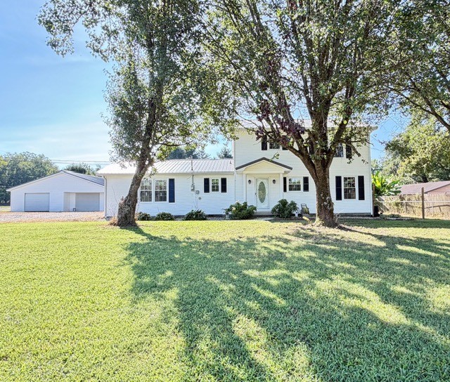 Welcome to this sprawling 4-bedroom, 3.5 bath home, beautifully situated on just over an acre and offering an incredible amount of space, comfort, and character! Step inside to find a wonderful blend of LVP, tile, and hardwood flooring, fresh paint, updated light fixtures, new windows, and gorgeous cabinetry throughout. The spacious living room is warm and inviting with a gas fireplace and built-in bookshelves, while the separate den/mancave featuring a stunning stone fireplace provides the perfect spot for relaxing, entertaining, or watching the big game. With a primary suite downstairs plus an additional master suite upstairs, this home offers a versatile layout ideal for multi-generational living, guests, or simply having plenty of room to spread out. Outside, you'll love the space and privacy of little-over-an acre lot, along with a very spacious detached garage complete with a wood heater. Spacious, updated, and full of character, this home offers room for everyone inside and out. Selling AS IS!