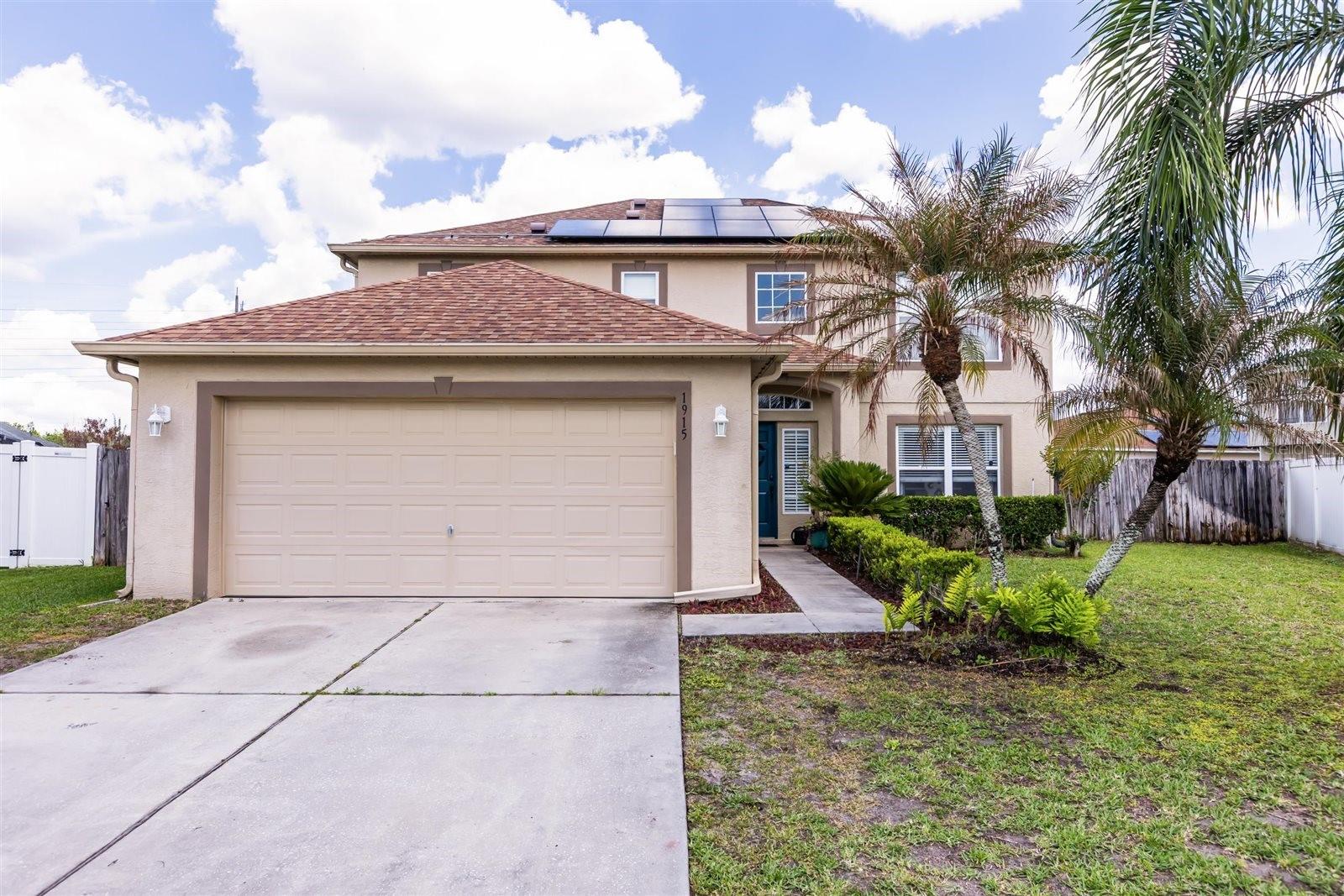 Welcome to this spacious 4-bedroom, 2.5-bathroom home located at 1915 Corner Crest Ct, Orlando, FL. The home is equipped with paid-off solar panels, providing energy efficiency with no payments or loan assumption required! With 2,224 sqft of living space, this home features an open floor plan, soaring ceilings, and a wealth of interior upgrades, including ceiling fans, high ceilings, stone countertops, and solid wood cabinetry. The kitchen is a chef’s dream with granite countertops, a kitchen island, and ample storage. Enjoy meals in the dining area, complete with a dining set. The primary bedroom offers a generous walk-in closet for added convenience.Step outside to the wide fenced backyard with a covered patio, perfect for relaxation or entertaining. Located with easy access to major roads (408, 417), Waterford Town Center, UCF, Research Park, and the Space Coast, this home is perfect for those seeking both comfort and convenience. Don't miss out on this exceptional property!