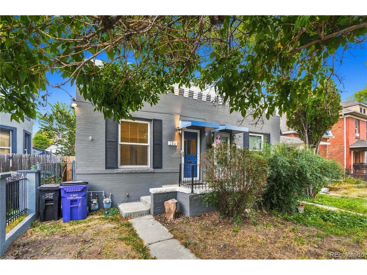 Location, character and classic Denver charm come together at 258 S Sherman Street. This 1909 rowhome offers an opportunity to own in a highly desirable central Denver location just blocks from the restaurants, shops and entertainment along South Broadway and less than a mile from Washington Park. Inside, original hardwood floors and exposed brick bring warmth and character to the home, complemented by an updated kitchen with shaker cabinetry, under-cabinet lighting and stainless steel appliances. The shotgun-style floorplan offers flexible living space, a full bath, in-unit laundry and central air. Step outside to a private fenced backyard with room to relax, entertain or garden. A rare oversized detached brick garage provides valuable off-street parking and additional storage. Easy access to the Cherry Creek Trail, downtown Denver and I-25 adds to the convenience. Whether you're looking for a primary residence, Denver pied-a-terre or an opportunity to put your own touch on a classic city home, this one delivers location, character and possibilities.