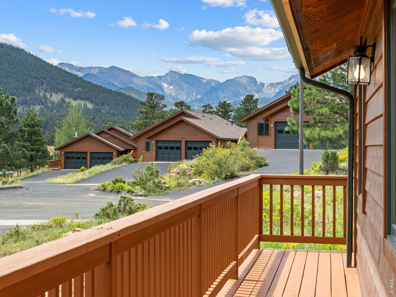 Beautiful one-level home in the Cedar Ridge neighborhood just a mile west of downtown Estes Park and minutes from the Beaver Meadows entrance to Rocky Mountain National Park. This 3-bedroom, 2-bath mountain retreat offers Continental Divide Snowcapped Mountain views, & the spacious back deck looks up at Prospect Mountain, to enjoy the surrounding forested hills, and for coffee in the morning sun. This perfectly-positioned home features open living, natural stone gas fireplace, workable kitchen and big garage, all with the ease of low-maintenance living. Thoughtfully designed for comfortable main-level living, the open floor plan creates a bright & welcoming space that's perfect for everyday living & entertaining. It's quality interior finishes add warmth and character throughout, while the expansive windows invite the stunning scenery indoors. Recent updates include new Kitchen counter tops, back-splash, appliances, faucet & flooring & lighting; also new flooring & lighting in dining room. The primary Bathroom has new countertop, faucet, & flooring. And there's new carpet in the Living Room. Primary suite has large walk in closet and 5 piece bath with double sinks, corner jetted tub plus walk in shower. Whether you're looking for a full-time residence, a mountain getaway, or a place to simply enjoy the beauty of Estes Park, this beautiful home is ready to welcome you. 680 Cedar Ridge Circle offers the best of Estes Park living.