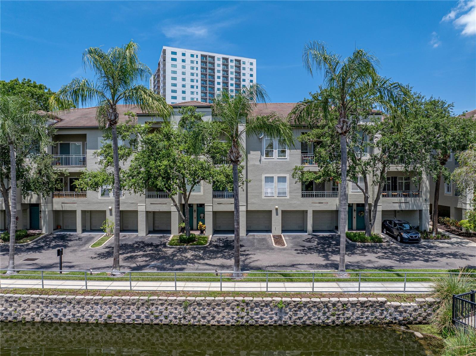 Island Place at Harbour Island - a gated community offering a lifestyle designed around comfort, convenience and luxury! Located a short, walking distance from Downtown Tampa this exquisite 3-bedroom, 2-bathroom townhome-style condominium offers an unparalleled blend of thoughtful functionality and effortless access to the city’s most sought-after destinations – including the Waterstreet District, Sparkman Wharf and the Amalie Arena. Meticulously, newly renovated, this residence showcases a split floorplan, elegant finishes and high-end fixtures and appliances throughout. High ceilings, luxury vinyl flooring and crown molding flow throughout the home, creating a sense of openness and sophistication from the moment you step inside. The main living area opens to a fully updated kitchen featuring sleek cabinetry, premium stainless-steel appliances, quartz countertops and a large breakfast bar—ideal for both everyday living and effortless entertaining. The spacious primary suite offers a peaceful retreat with a fully remodeled ensuite bath, complete with a dual-sink vanity, custom tilework, a walk-in shower and generous walk-in closet. Additional highlights include a large laundry room with full-size washer and dryer, ample storage throughout, oversized 2-car garage with ample storage and shelving and a private balcony offering tranquil lakefront views – perfect for morning coffee or unwinding at the end of the day. Residents of Island Place at Harbour Island indulge in exclusive access to resort-style amenities, including two pools, hot tubs, a state-of-the-art fitness center, playground, resident clubhouse, community grills and more.  Whether seeking a tranquil escape or an urban lifestyle, this residence delivers the best of both worlds. A rare offering in one of Tampa’s most coveted gated communities – this is more than a home, it’s a lifestyle and truly a must see!