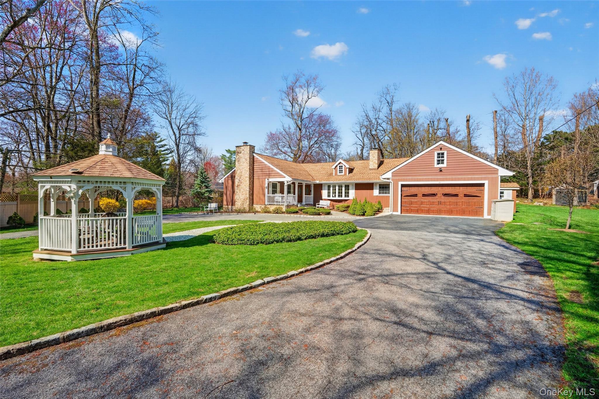 Nestled at the end of a serene cul-de-sac in sought-after Hartsdale, this exceptional ranch-style residence offers a rare combination of refined luxury, privacy, and timeless design. Set on an expansive 1.0299-acre estate, the property is introduced by an elegant circular driveway centered around a charming gazebo, creating a grand and unforgettable arrival.Thoughtfully designed for both comfort and sophistication, the home features 3 spacious bedrooms and 3 full bathrooms, including a beautifully appointed, fully handicap-accessible bath. The interior is enhanced by two fireplaces, one a classic wood-burning centerpiece, adding warmth and ambiance throughout the living spaces.Designed for elevated indoor-outdoor living, the grounds boast a covered pergola with a third wood-burning fireplace, offering an idyllic setting for intimate gatherings or luxurious entertaining in every season. The lush, private surroundings provide a true retreat-like atmosphere, all within a quiet and prestigious neighborhood.Additional highlights include a 2-car garage and a prime location just 8 minutes from the train station, ensuring effortless access to Manhattan. Enjoy close proximity to the renowned Sunningdale Country Club and the town pool, further enhancing the lifestyle this remarkable home affords.A rare offering that seamlessly blends elegance, comfort, and exclusivity. This is luxury living at its finest.
