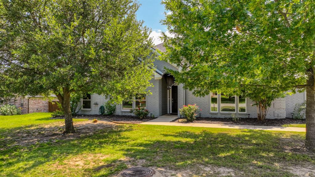 Beautifully updated open-concept home on a spacious half-acre in Aledo, featuring a smart layout with a large living area, cozy fireplace, and an oversized game room perfect for entertaining. Custom upgrades include ceramic wood-look tile throughout, custom cabinetry, granite countertops, and a large kitchen island. The property also offers a 3-car garage and a 24x36 workshop with electricity, including a 100-amp sub panel, 50-amp circuit for a welder, and 130-amp breaker for an air compressor. Enjoy summer fun in the under the covered patio in the huge backyard, complete with a hot tube.. Take in the peaceful country views—complete with friendly horses that often visit at the fence line.